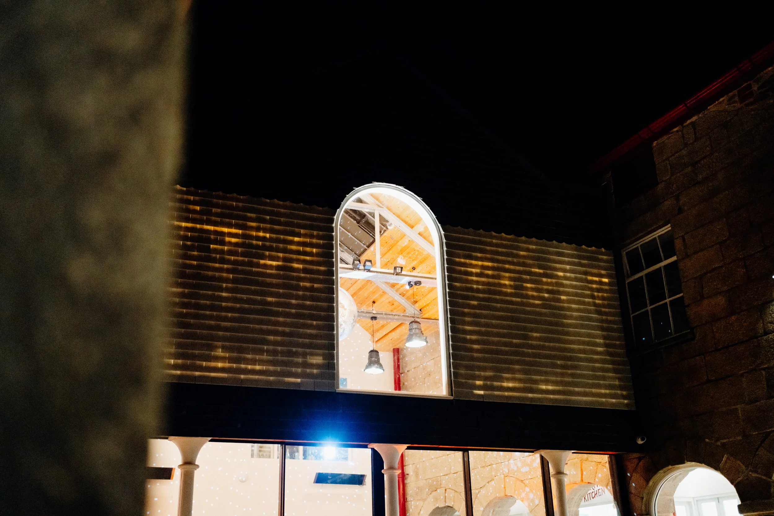 A detailed nighttime shot of the Buttermarket courtyard, revealing the luminous interplay of light through the fused recycled glass tiles. Photo: Huw Briscoe