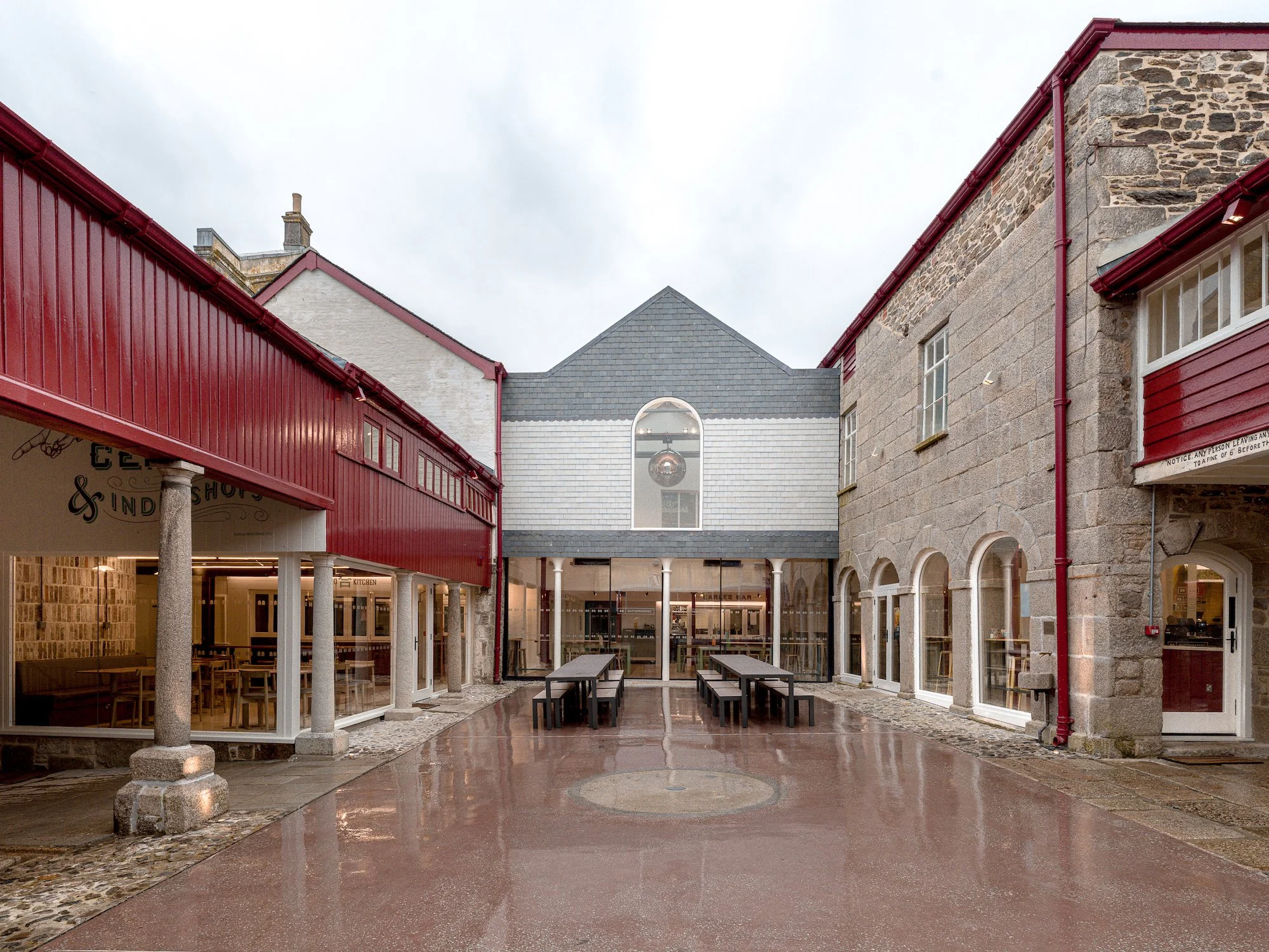 The iconic courtyard at the Buttermarket showing the recycled glass wall in white tiles and gray slates. Photo: Claire Fear