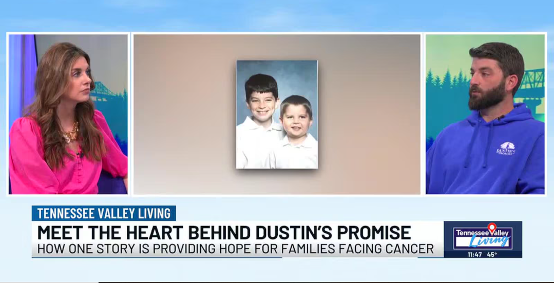 Screenshot of a television talk show featuring a woman in a pink blouse and a man in a blue hoodie, with a portrait of two young boys on a wall between them, discussing a story that offers hope for families facing cancer.