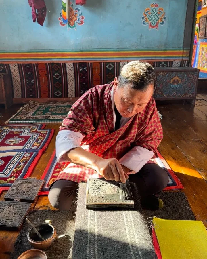 The most special afternoon - stamping handmade prayer flags and then sharing a delicious Bhutanese lunch in a traditional farmhouse. The light, the colors.. it was so magical ✨