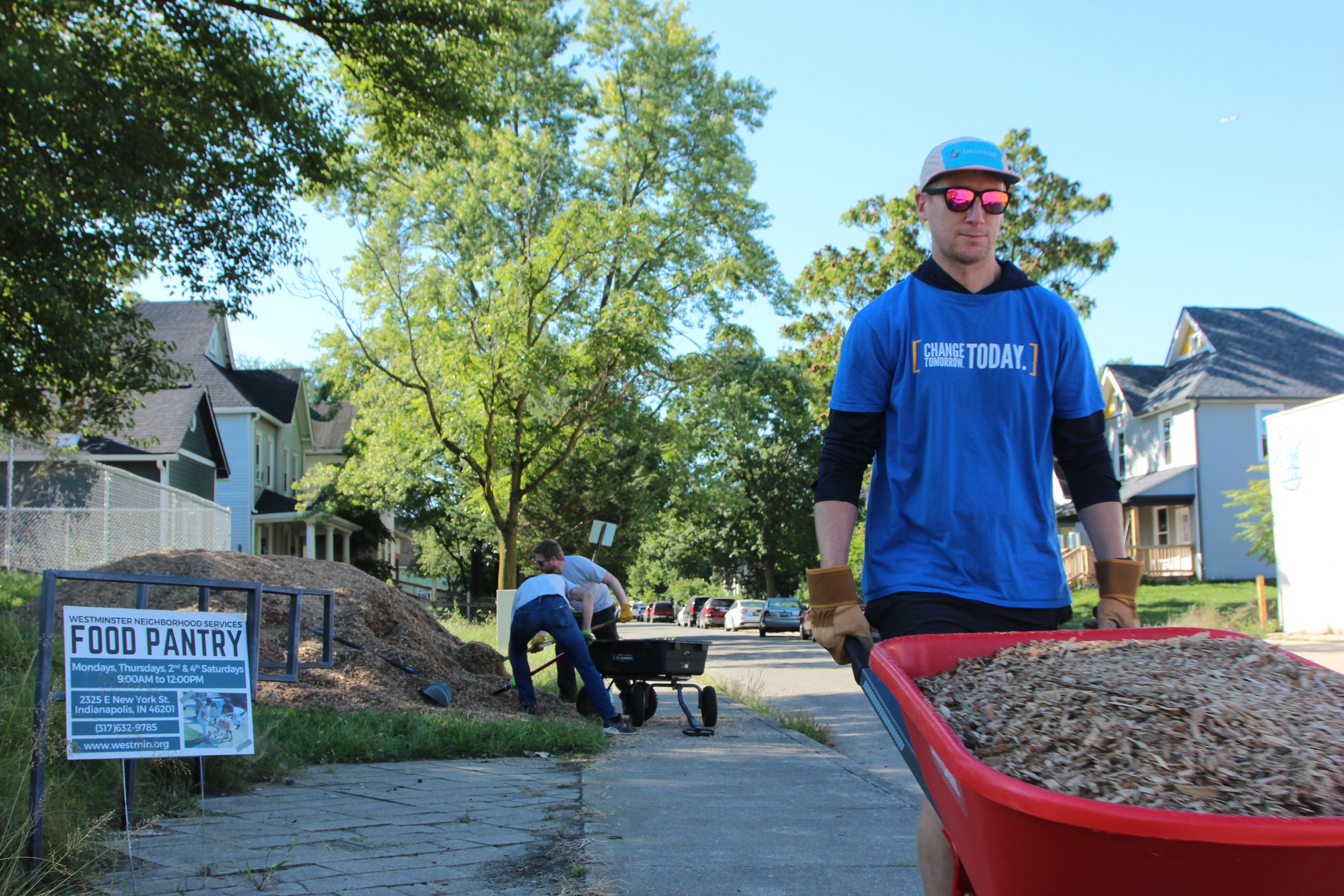  Volunteers spread fresh mulch for a playground Sept. 9, 2021,  at Westminster Neighborhood Services for United Way of Central Indiana’s first Go All IN Day. 