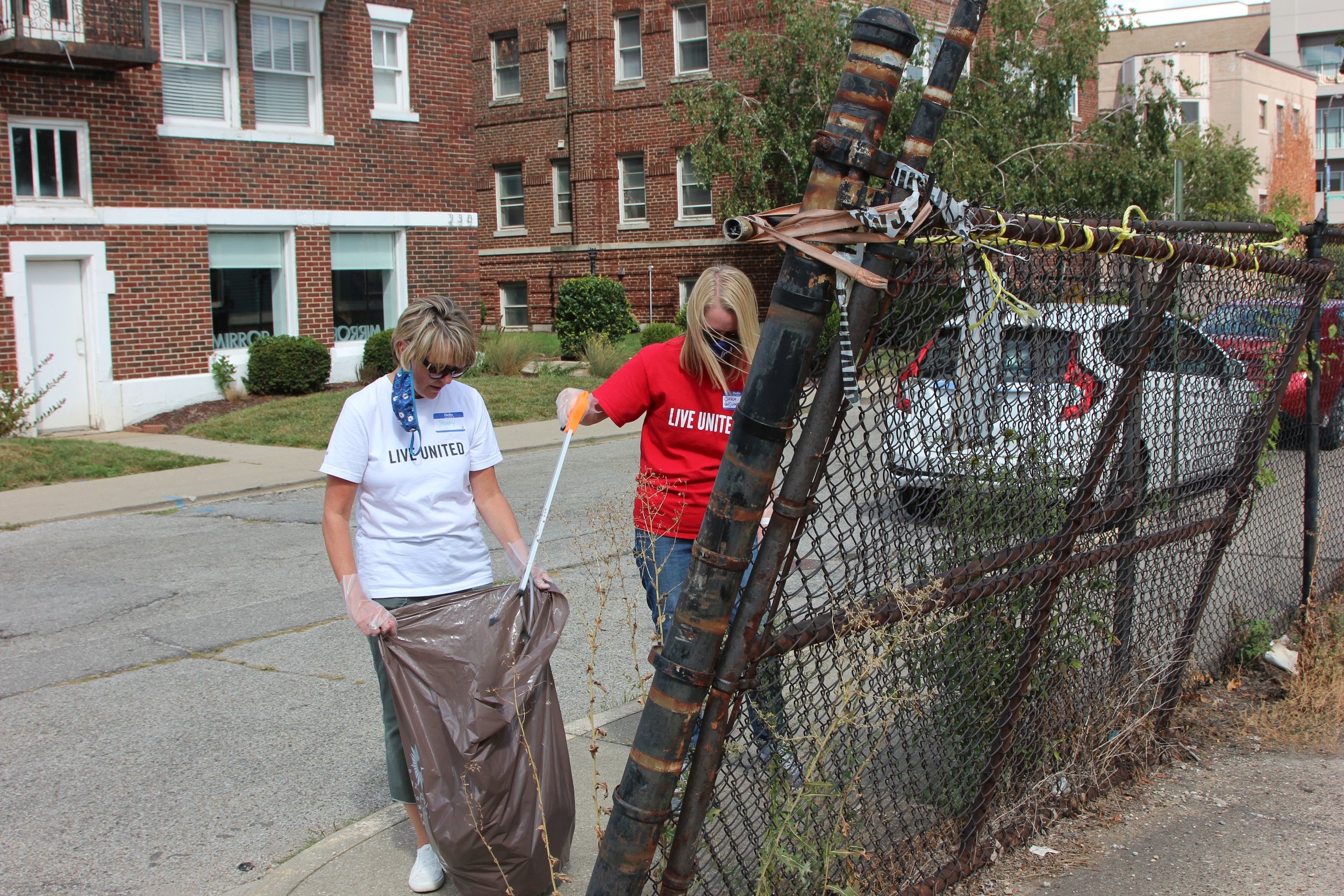  Volunteers pick up trash outside Recovery Café Indy Sept. 9, 2021,  for United Way of Central Indiana’s first Go All IN Day. 