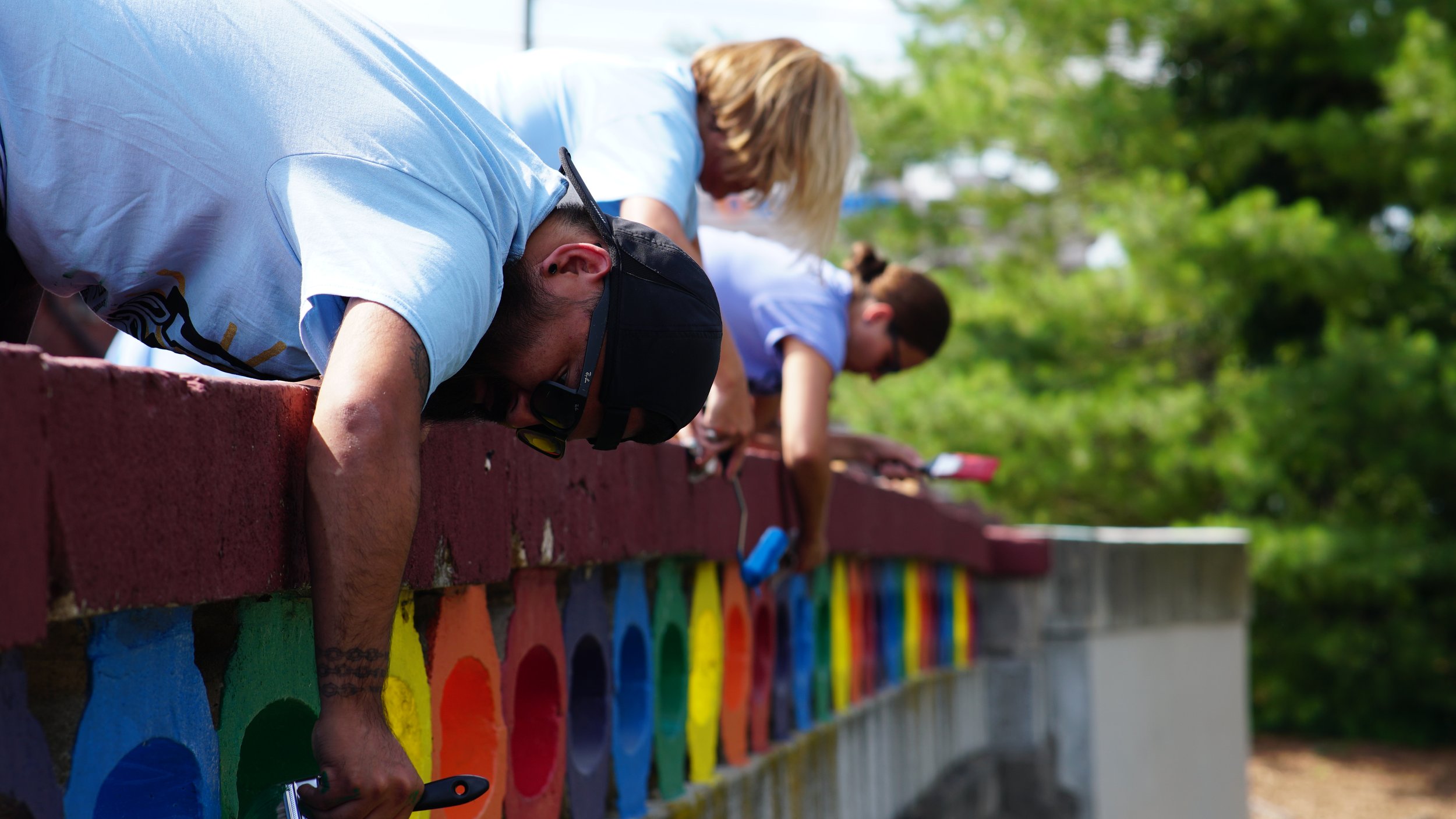  Volunteers paint the Rainbow Bridge in Broad Ripple on June 24, 2022, as part of United Way of Central Indiana’s Go All IN Day.  