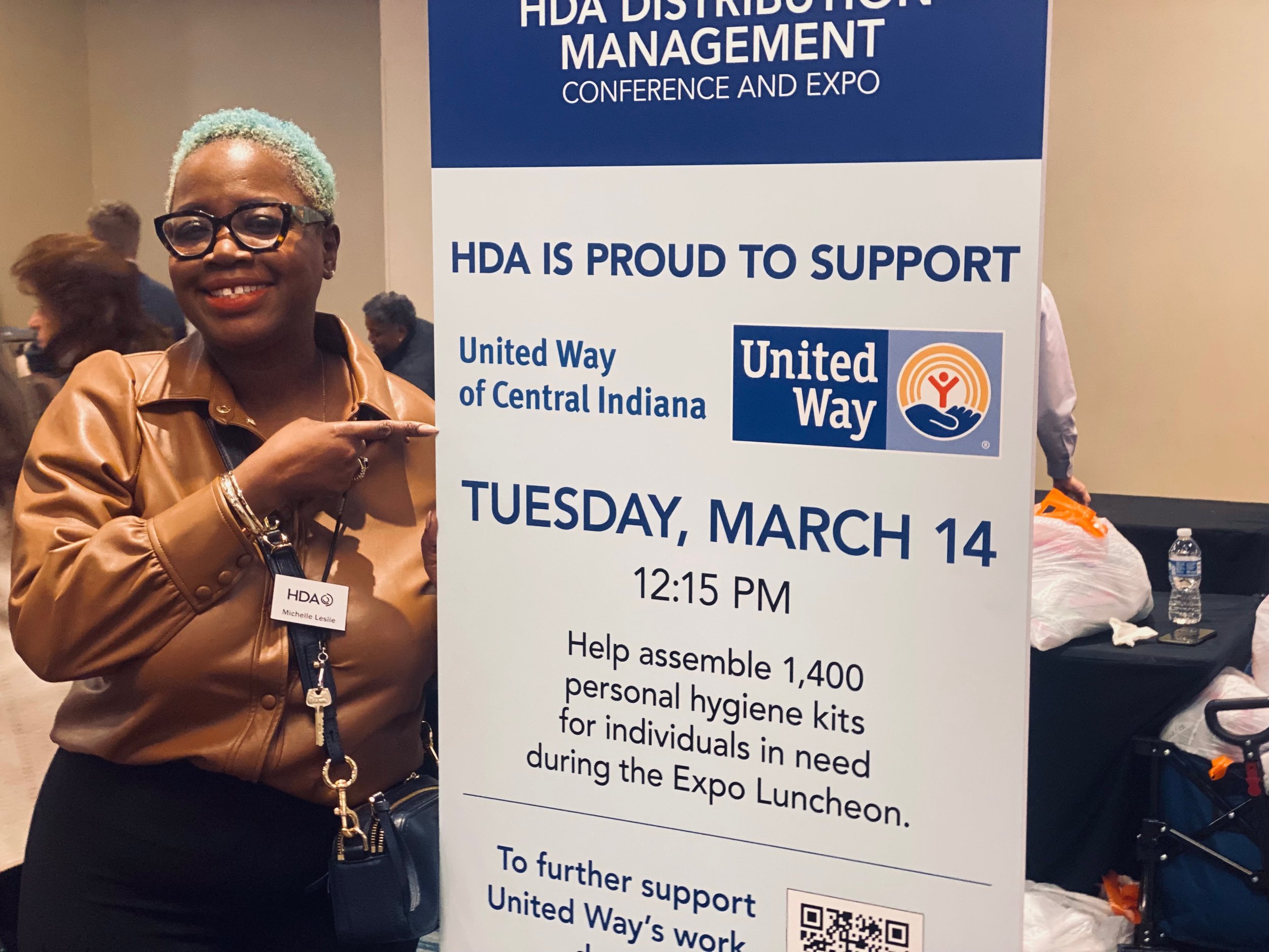  Michelle Leslie, associate director of membership and education for Healthcare Distribution Alliance, poses with a sign March 14, 2023, during the organization’s conference at the JW Marriott in downtown Indianapolis. HDA partnered with United Way o