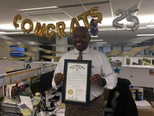  Jeffrey Wilson poses in March 2019 — when he celebrated 25 years with United Way — holding a proclamation signed by Indianapolis Mayor Joe Hogsett declaring March 14, 2019, as Jeffrey Wilson Day. (Photo courtesy of Jeffrey Wilson) 