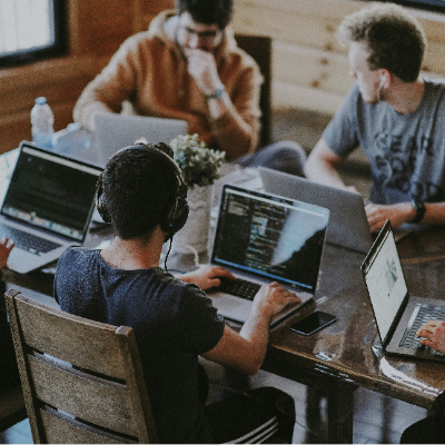 Group of employees working together at a table.