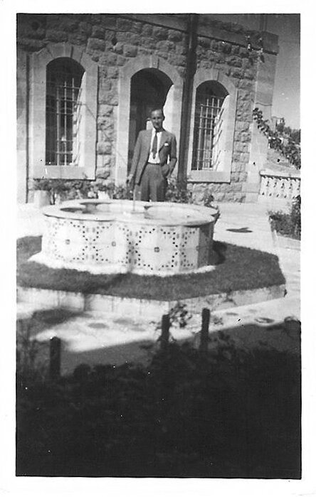 Historic family photo showing the original fountain, now demolished, and garden in front of the home