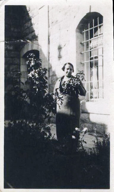 Historic family photo of garden and extant home in background