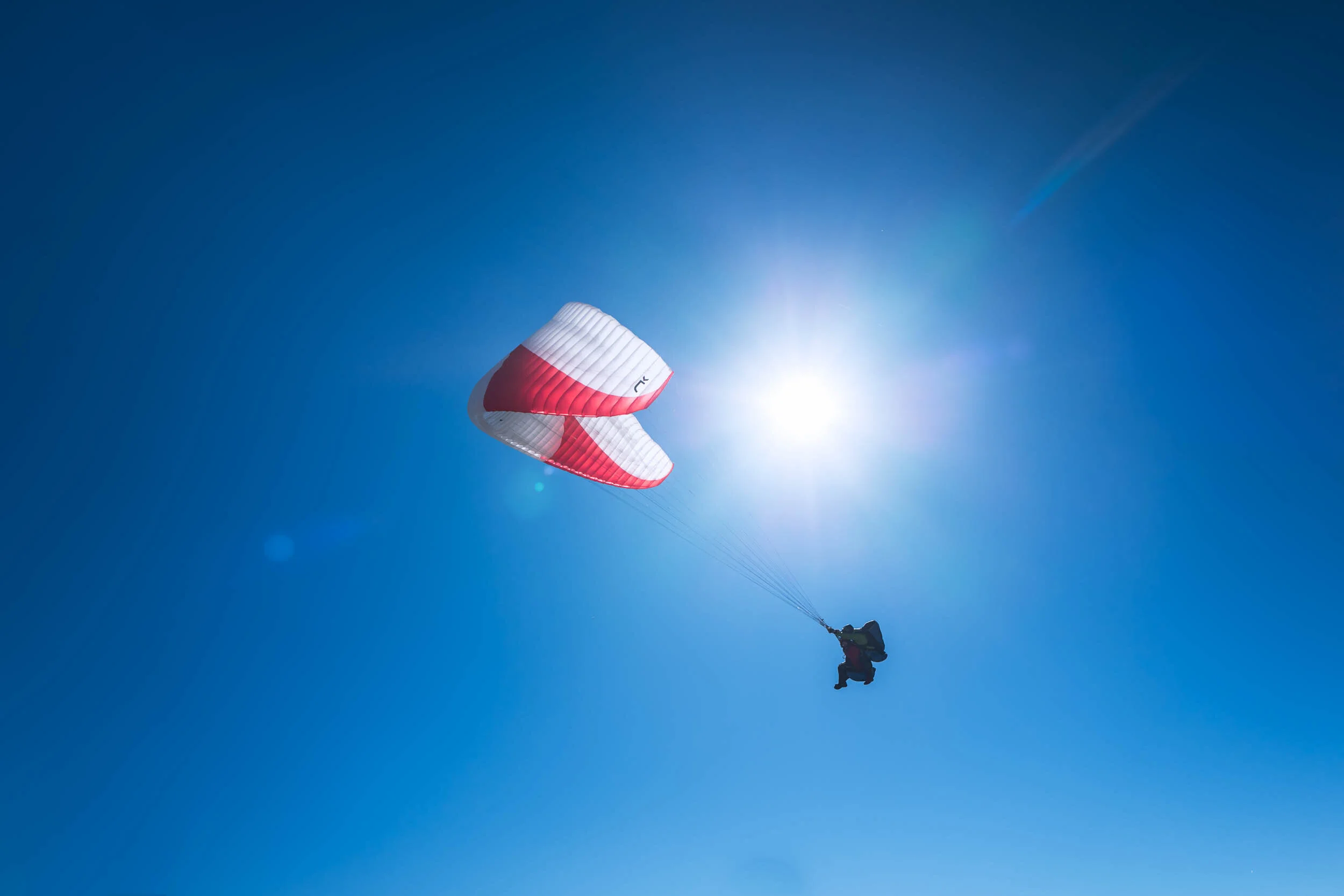 L1150539-paraglider duo flying in sun pilatus mountain-full-2500.jpg