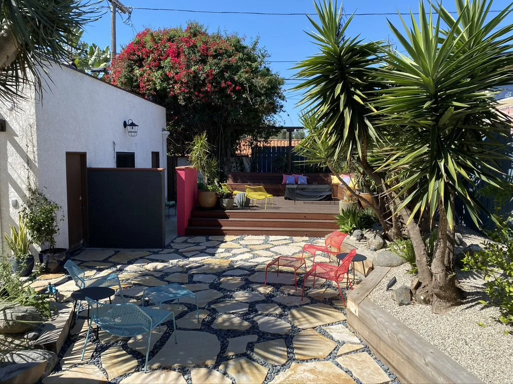 Spanish colonial backyard landscaping with pavers, wooden deck