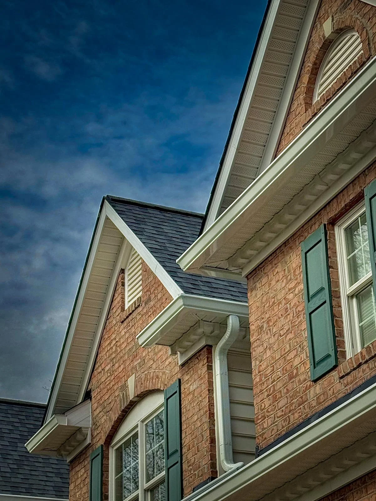 Country View Builders installing a premium leaf-protection gutter guard system on a recent installed roof in Howard County
