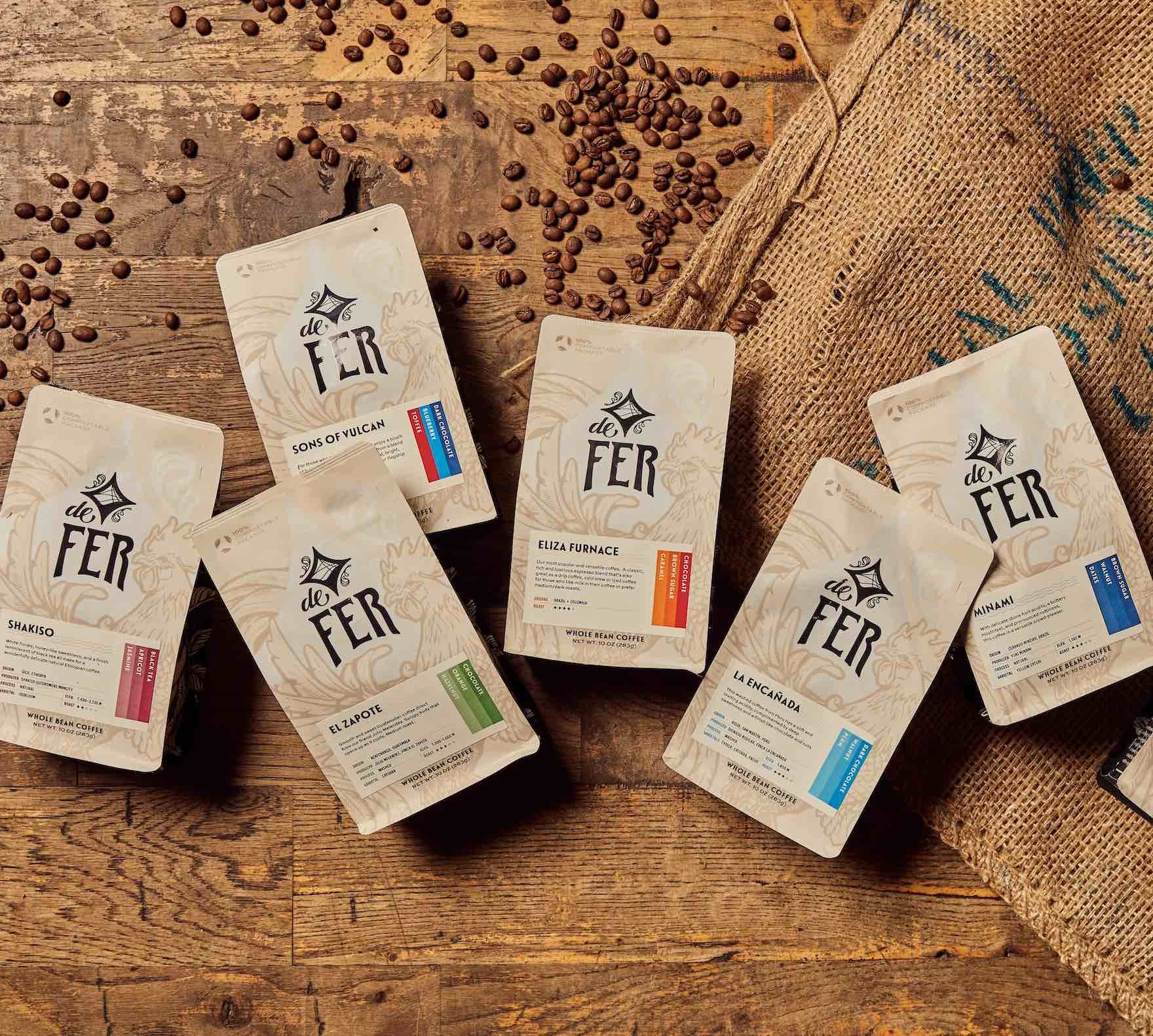de fer coffee subscription, light roast, medium roast, and mix of medium and light roasts, coffee bags with beans around