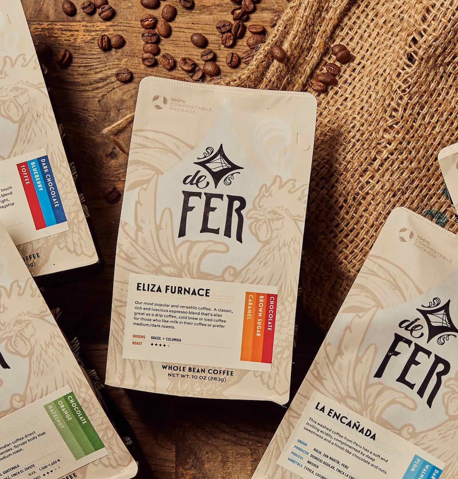 de fer coffee subscription, light roast, medium roast, and mix of medium and light roasts, coffee bags with beans around