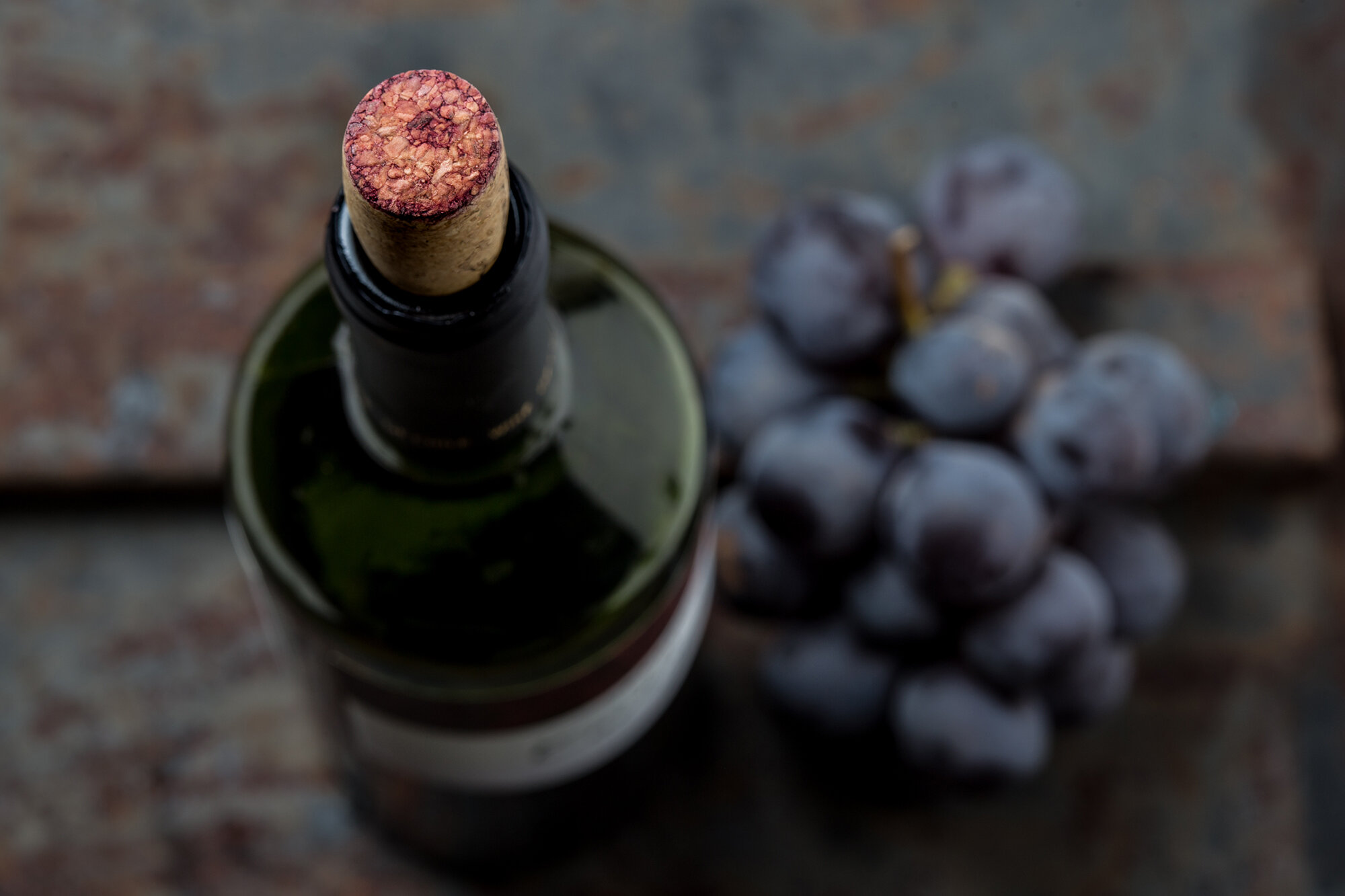 top-view-of-red-wine-bottle-macro-selective-focus--W7GLEFJ.2.jpg