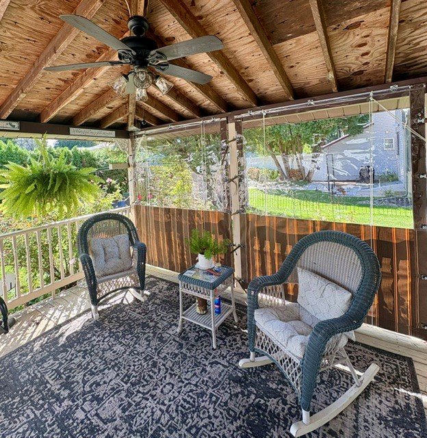 Clear Vinyl and Sunbrella Drop Curtains.jpg