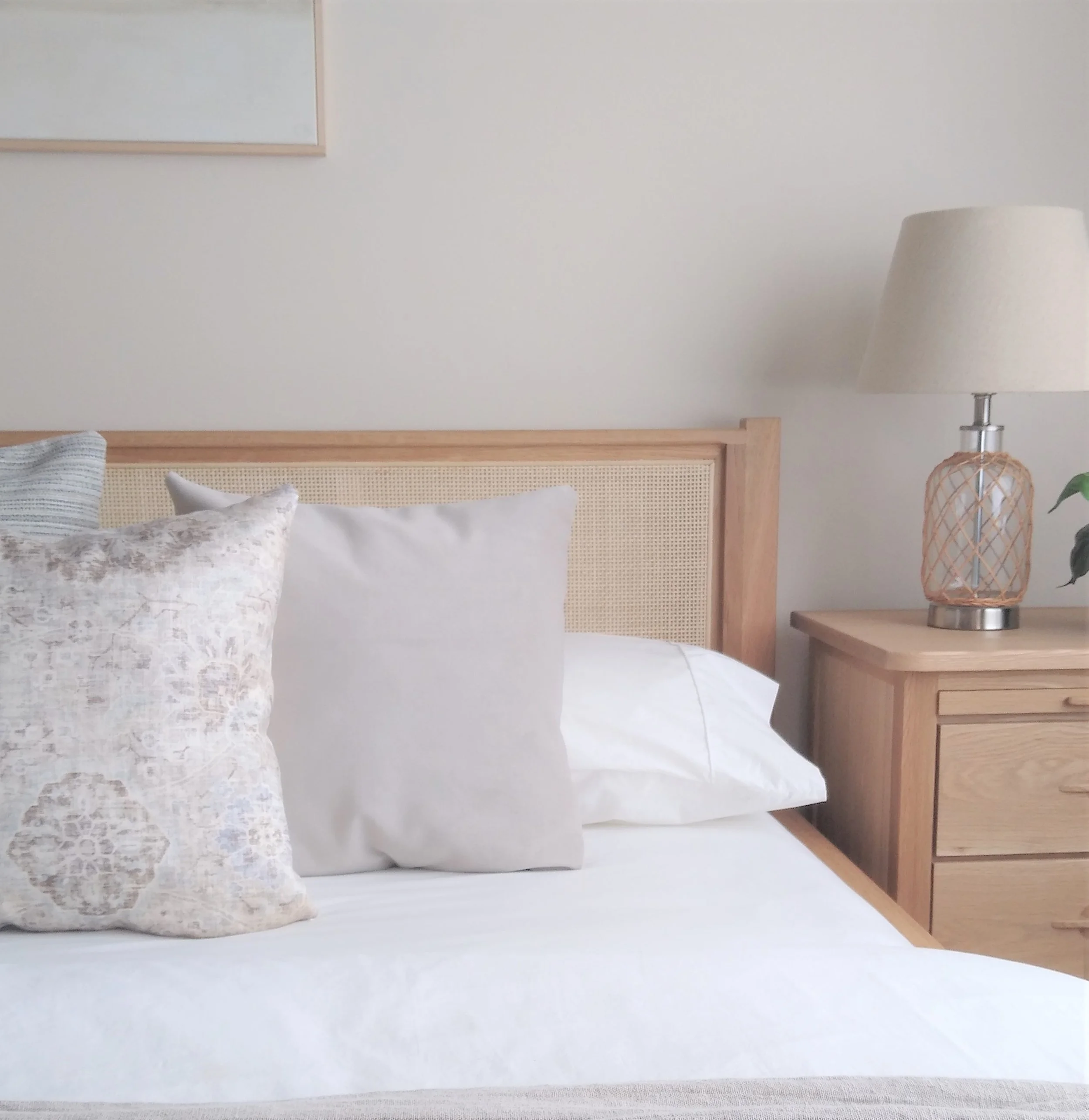 cane-bed-with-neutral-bedding.jpg