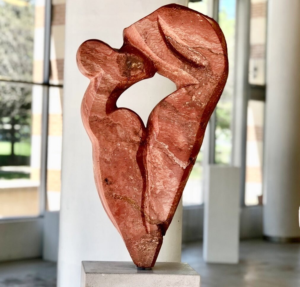 An old Flame at the Canadian Sculpture Centre. 

This piece titled Flame, was inspired by the strength and power of the athletes in the Olympics. The stone is a beautiful Persian Travertine, which is extremely difficult to work with and required a gr