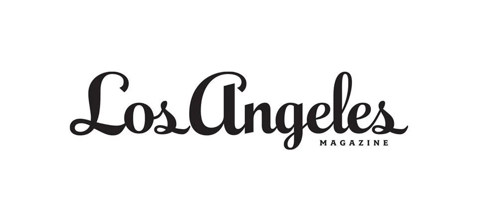 Los Angeles Magazine logo in black cursive font on a white background.
