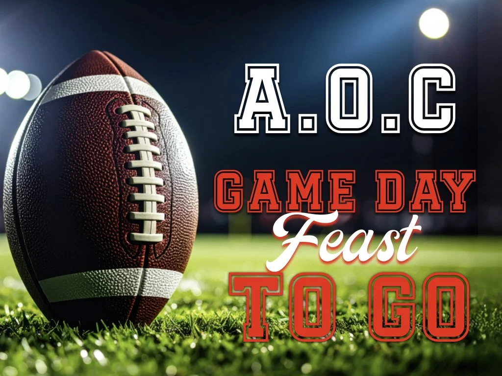 An American football on a grassy field with blurred stadium lights in the background. Text overlay says, "A.O.C GAME DAY Feast TO GO."