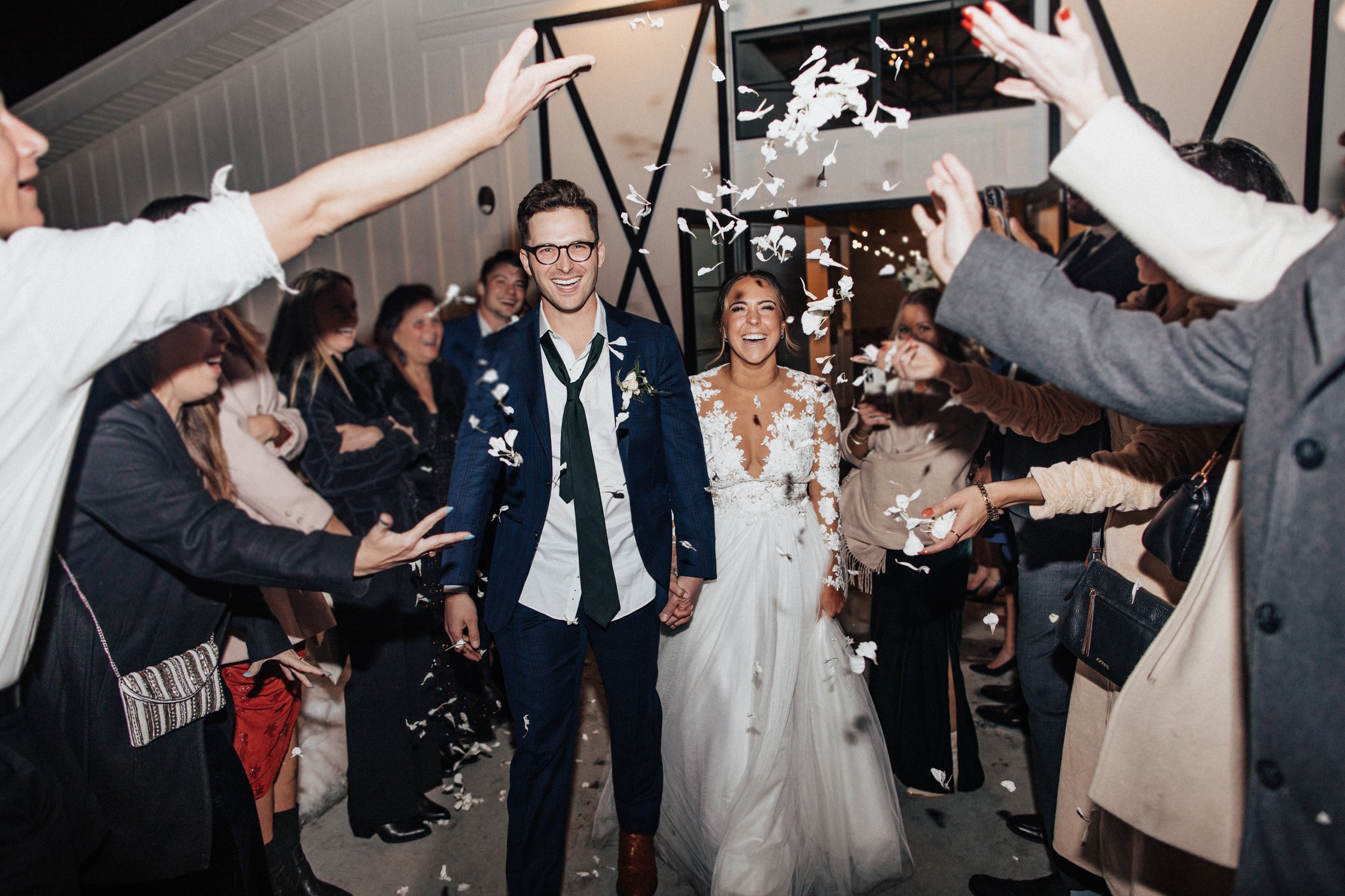 bride and groom at their send off at their woodlands wedding venue