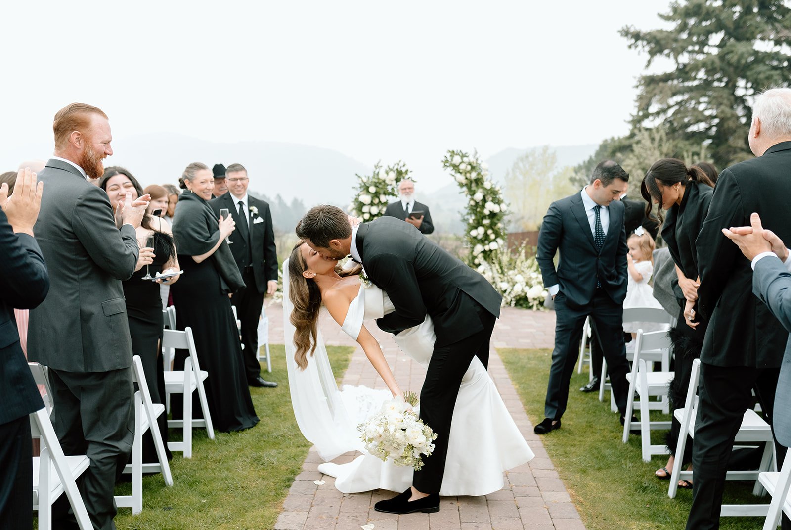 bride and groom kissing at Crystal & Derek's Elegant Destination Wedding in Colorado at The Manor House