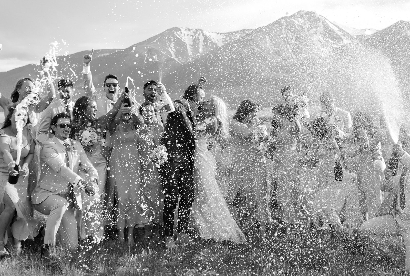 pop the champagne for Madeline and Matthew's Fairytale Wedding at A Mountain Wedding Venue Colorado