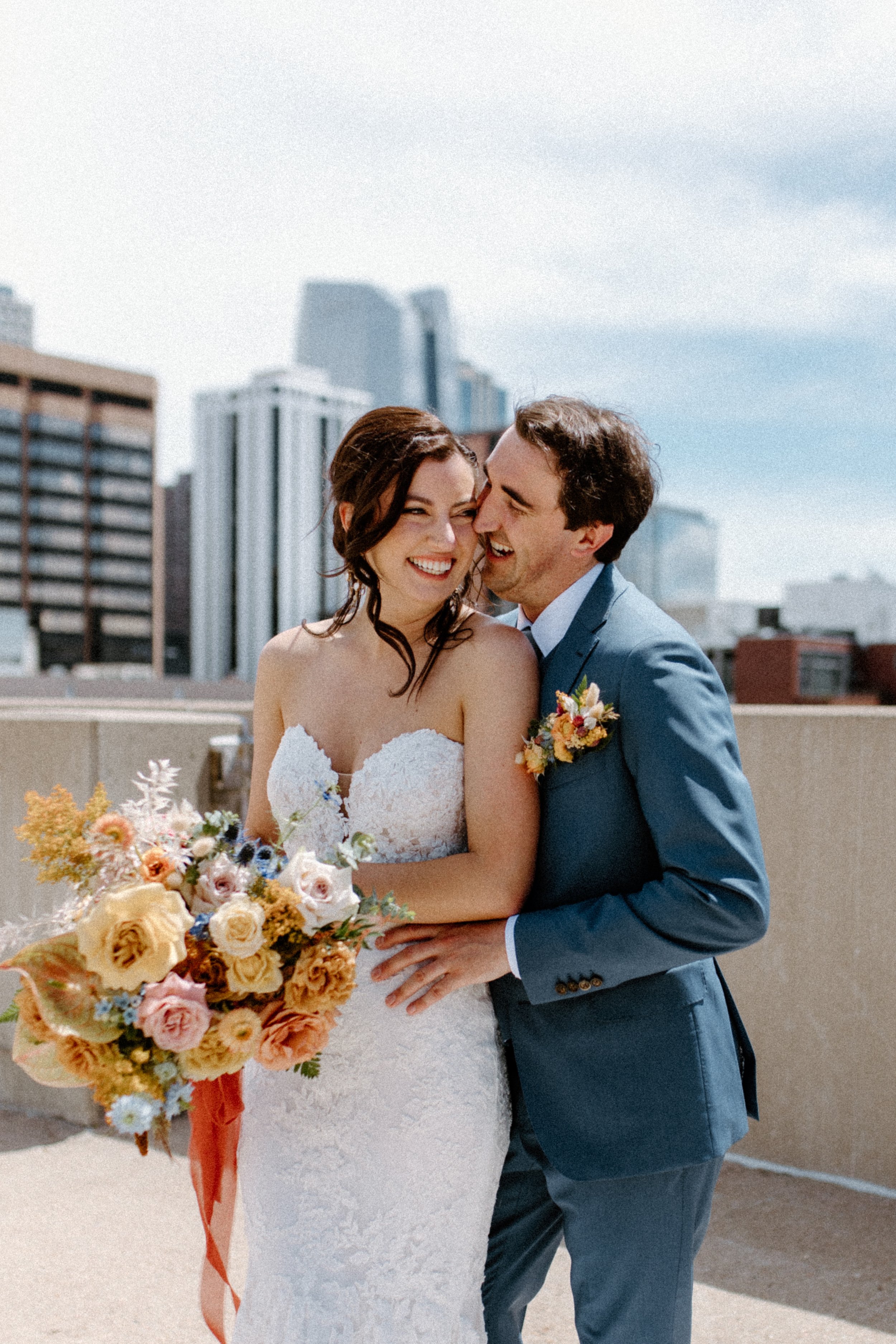 bride and groom photos on top of a parking garage for wedding reception ideas