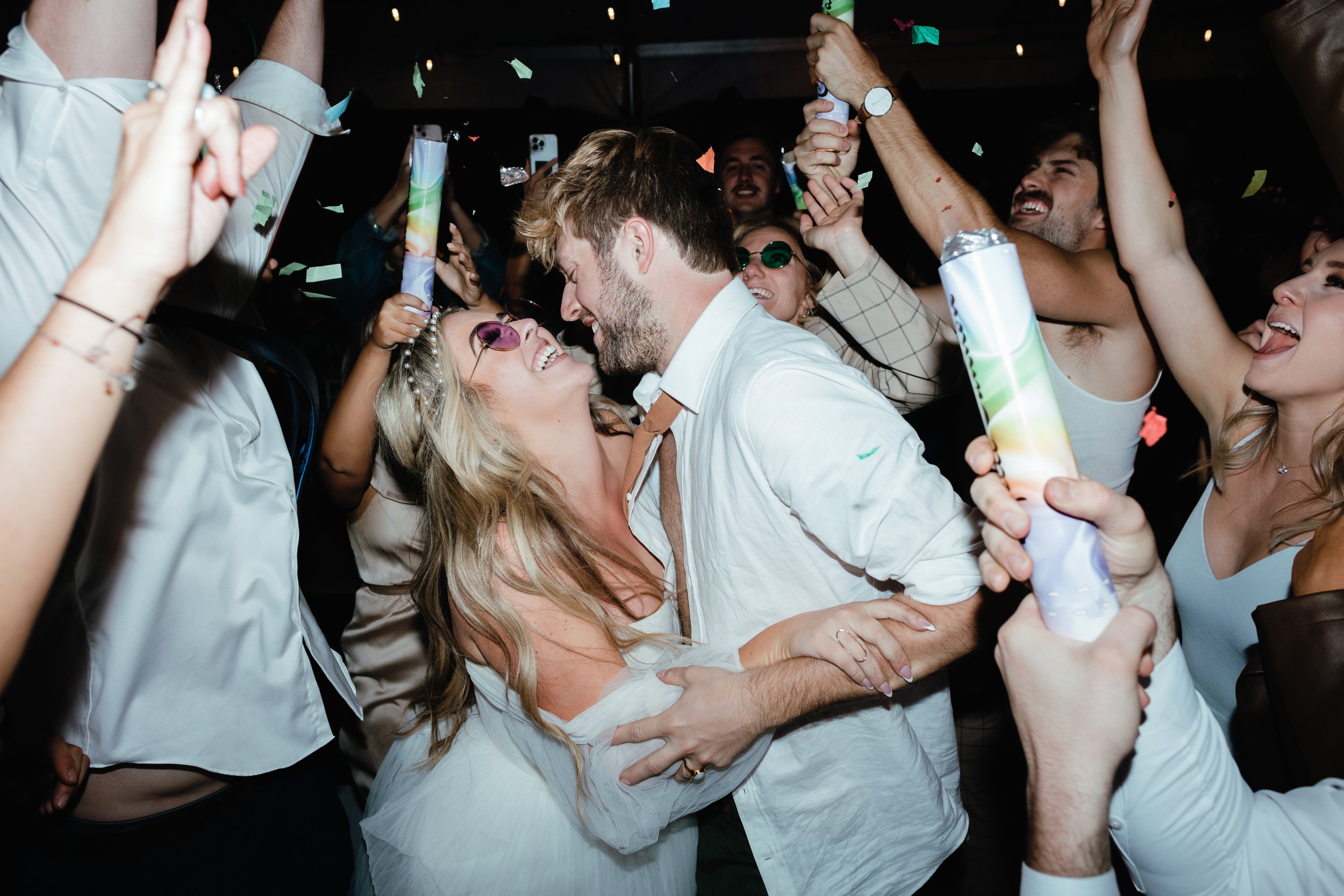 bride and groom partying at their reception with a colorful wedding palette