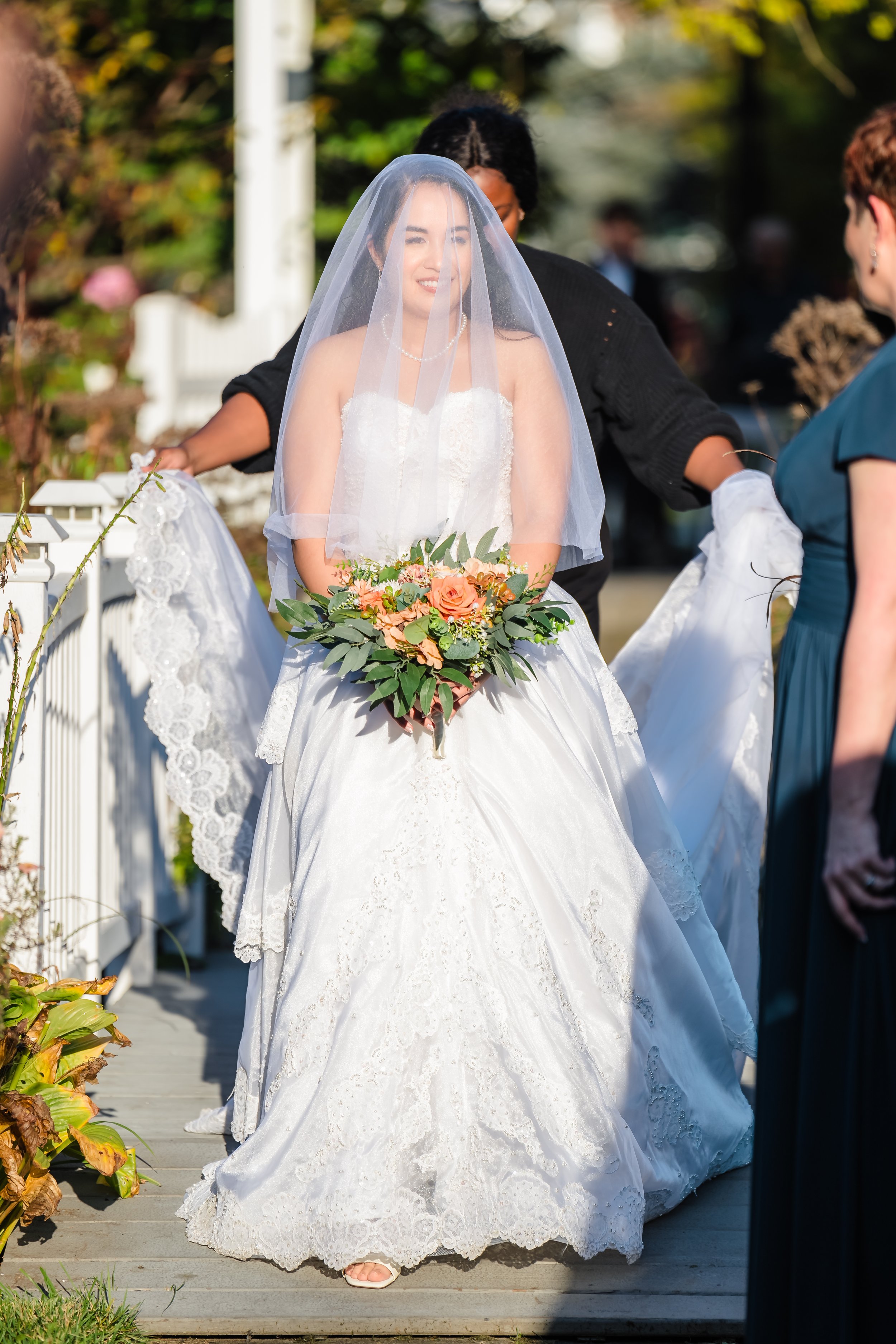 Bride walking down the aisle at Queen's Botanical Garden, New York