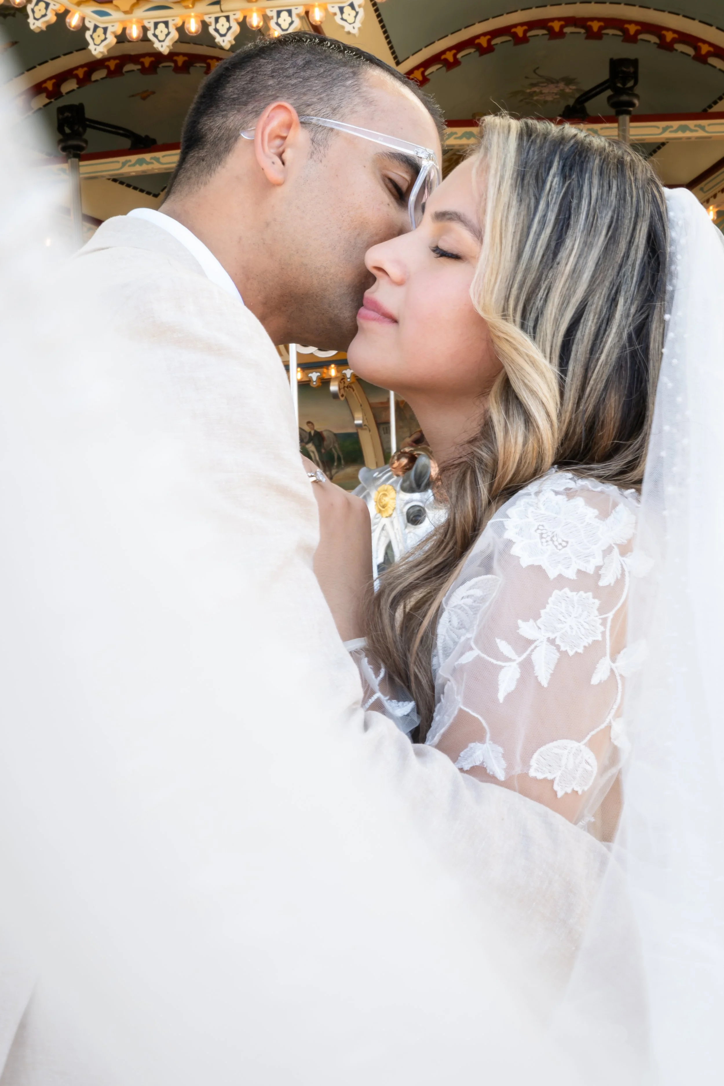 Bride and groom at Jane’s Carousel in DUMBO, Brooklyn, New York.