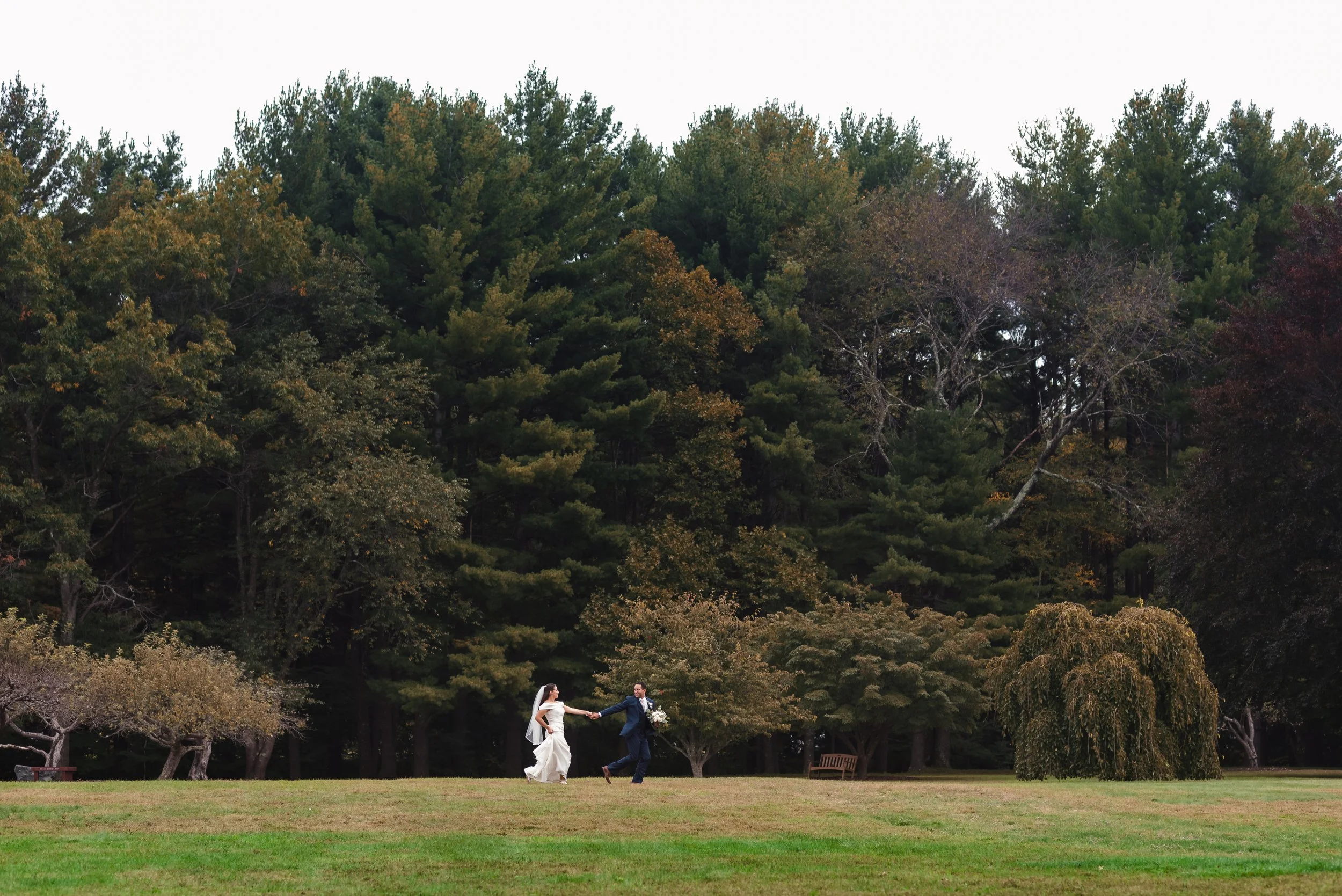 Bride and groom at wedding in Boston, Massachusetts park lawn