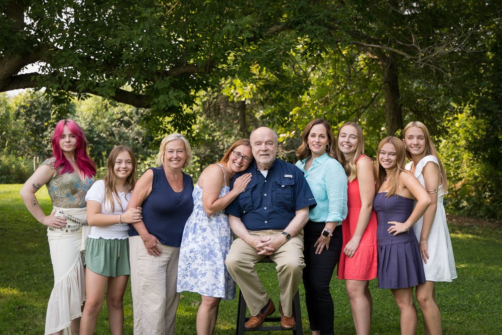 multi-generational family portrait with all girls and a dad