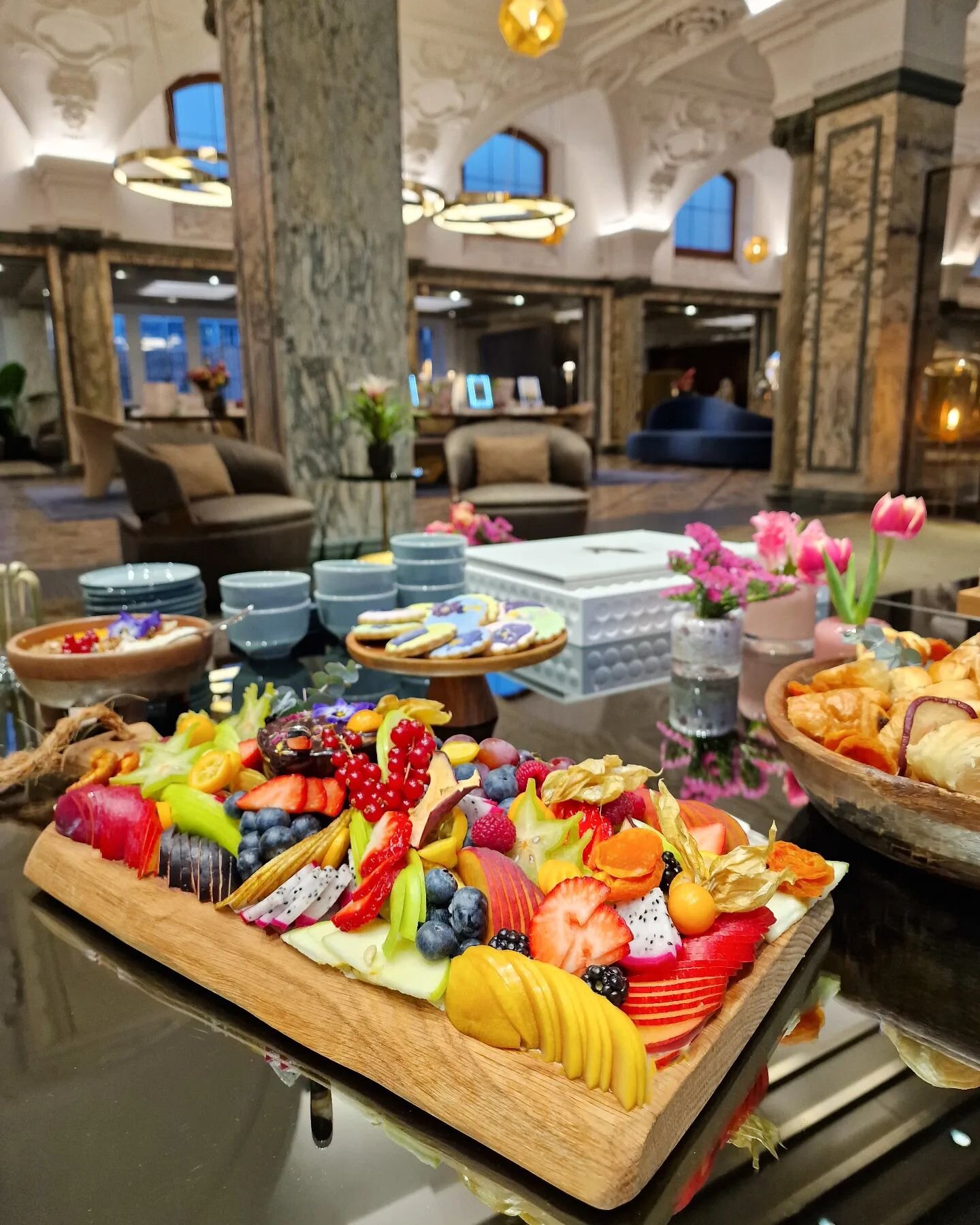 Fruity and colorful &quot;ladies breakfast&quot; from our recent event at Audemars Piguet in Bahnhofstrasse. Freshly baked pastries, fruit, Greek joghurt topped with fruit &amp; granola, dark chocolate ganache and our signature flower cookies. Delici