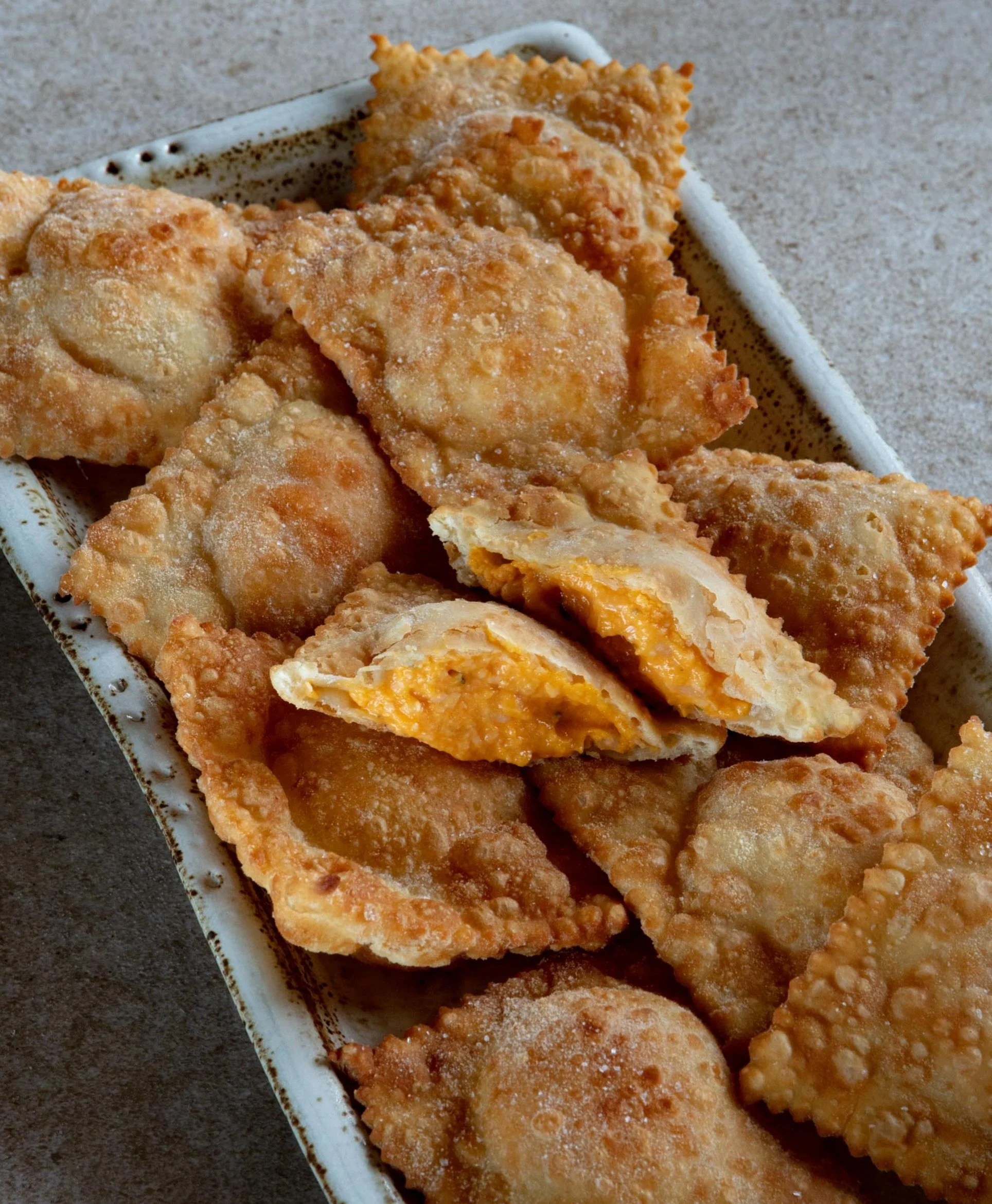 These fried pumpkin ravioli hail from the border where the Italian and French rivieras meet. Called barbagiuai on one side, barbajuan on the other, the exact filling varies from town to town. The dough is pasta matta, &lsquo;crazy pasta,&rsquo; which