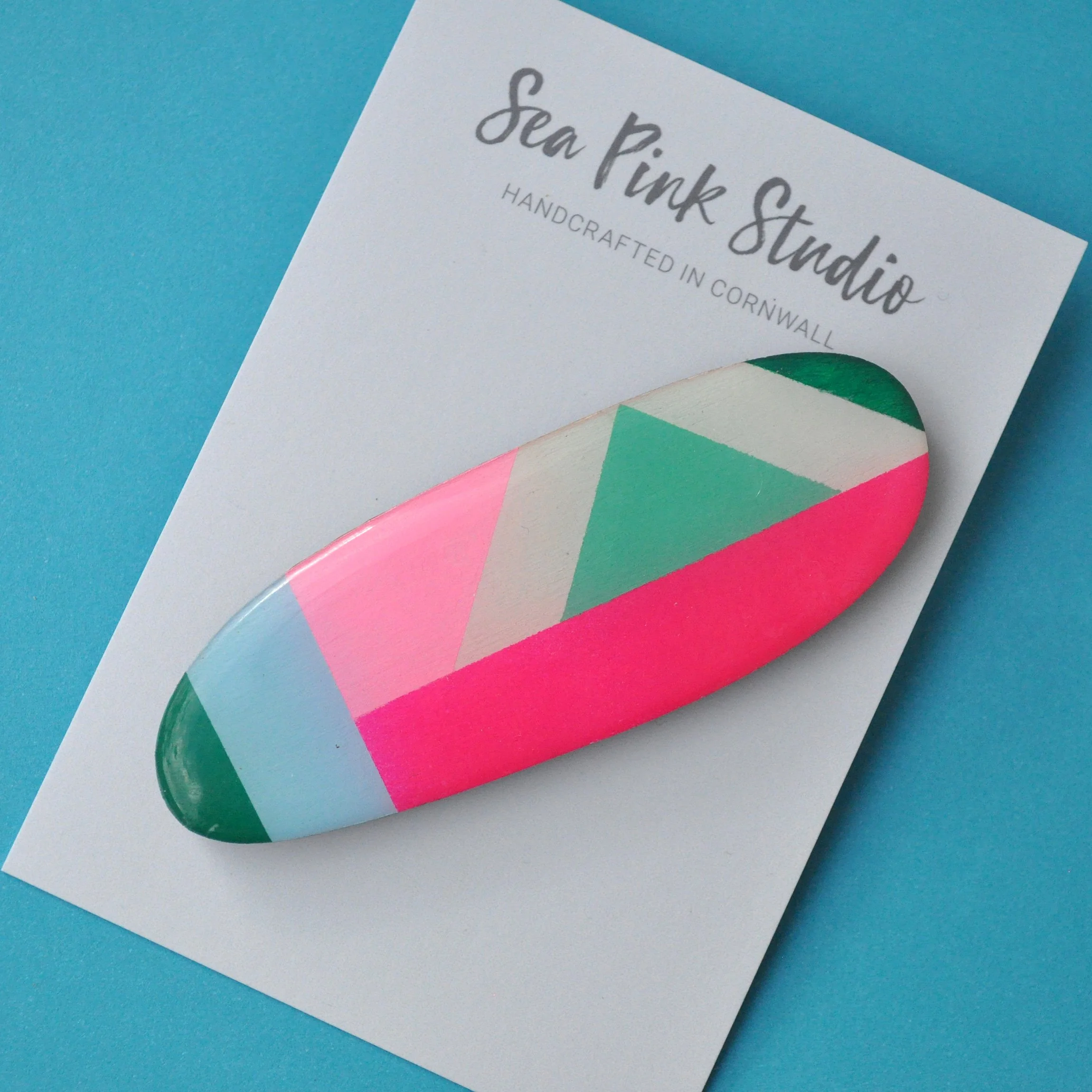 Colourful wooden hair slide in geometric pattern