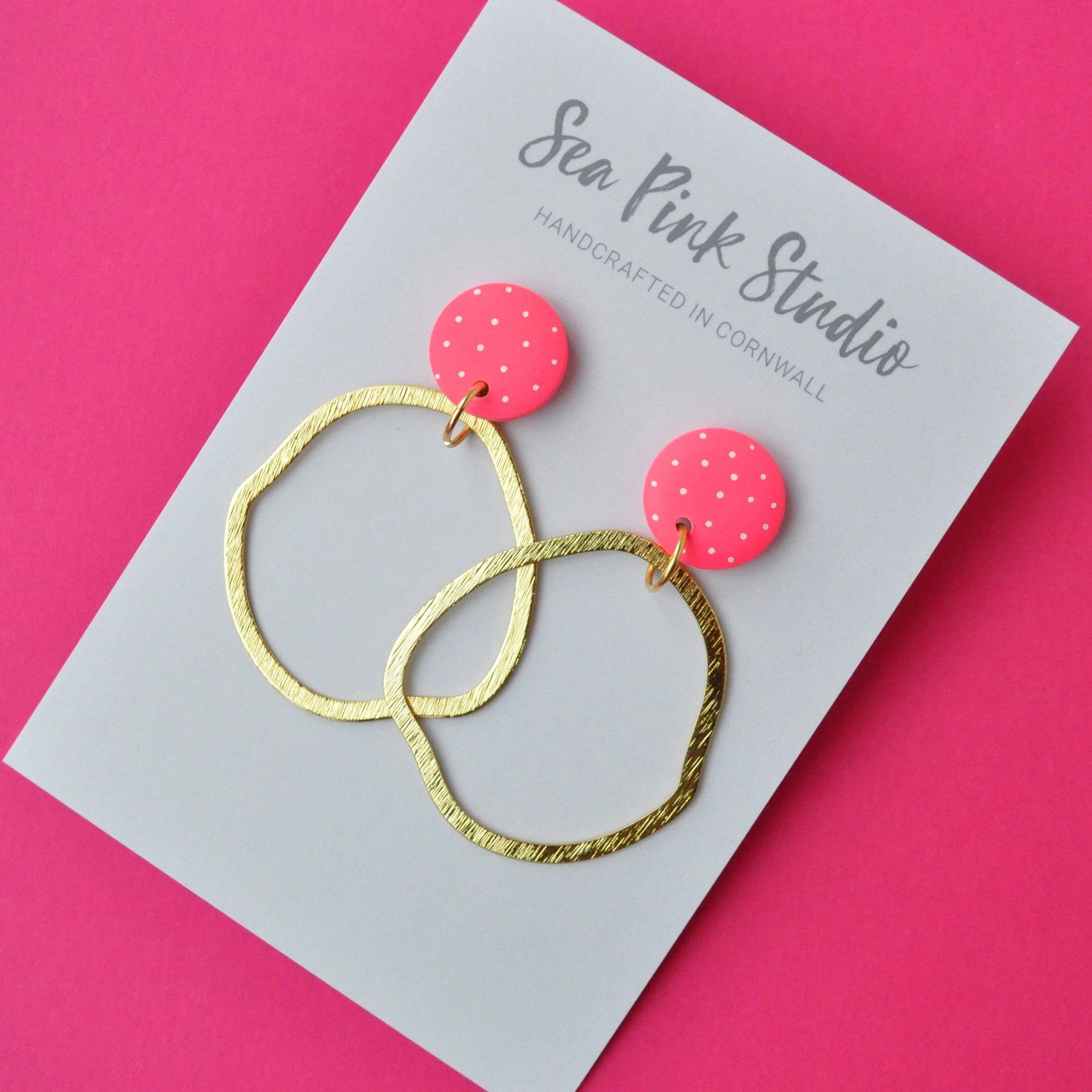 neon pink spotty earrings