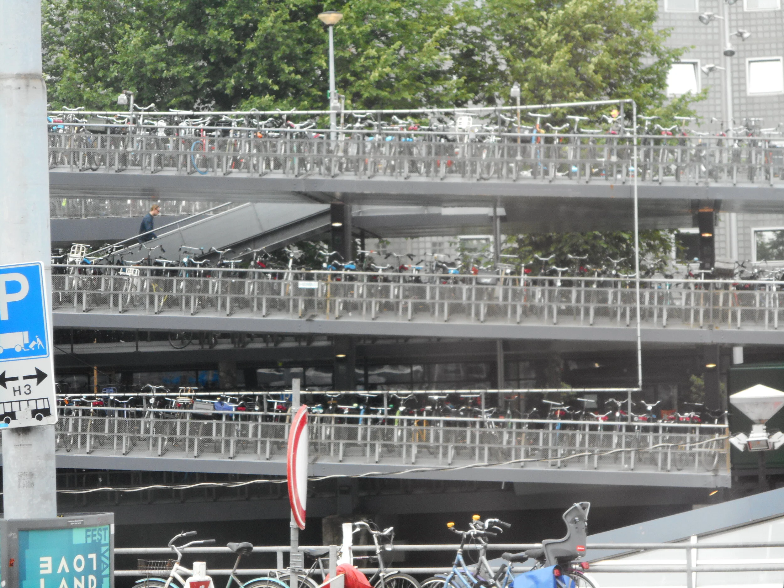 1000's of bicycles lined up in a parking garage