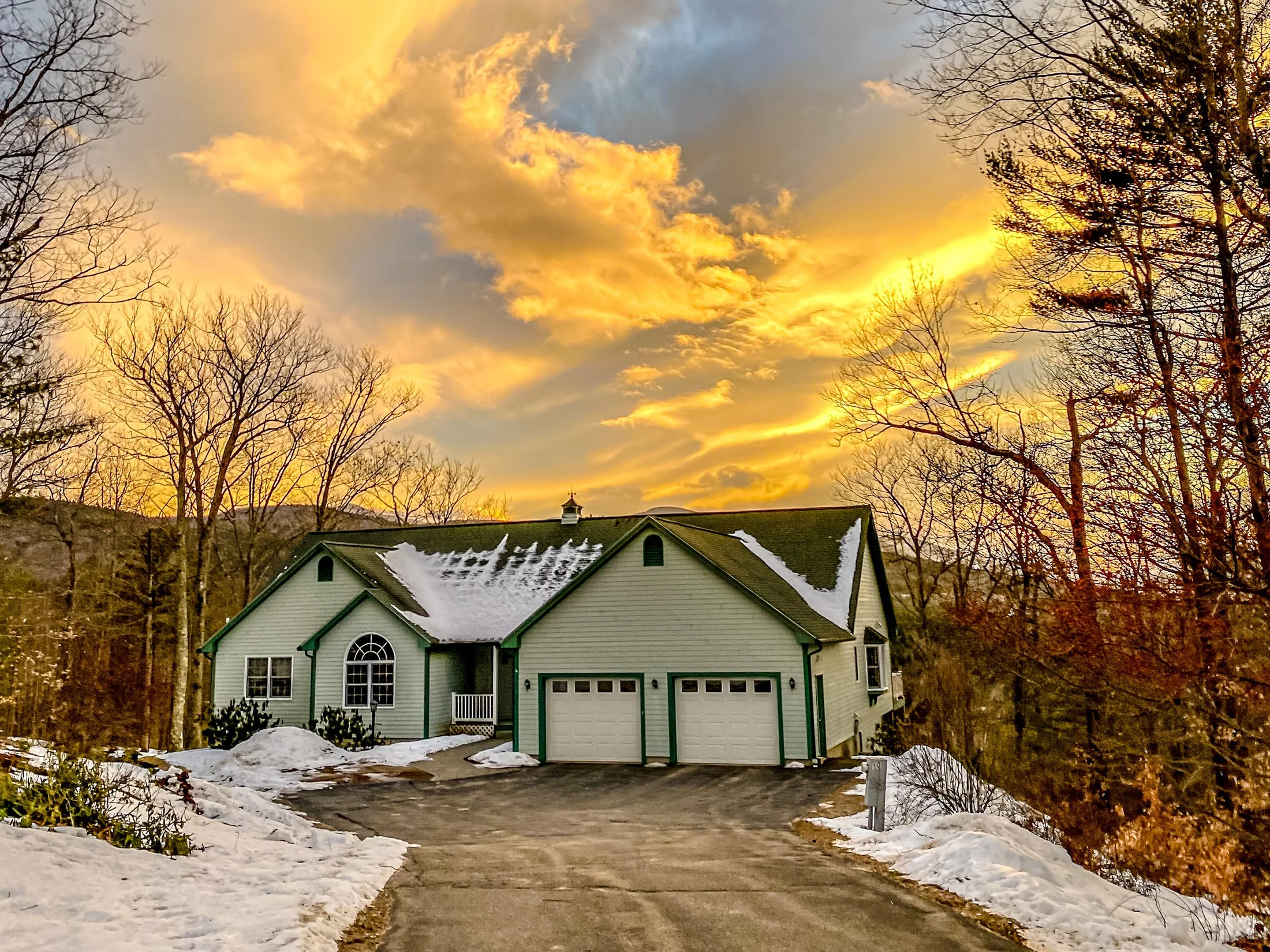 Beautiful mountain home in the White Mountains at sunset.