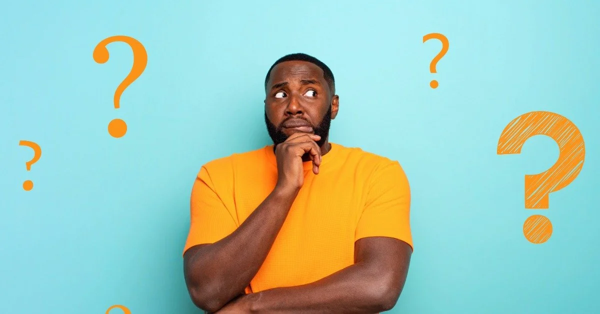 A man in an orange shirt looking thoughtful, surrounded by question marks, representing common questions buyers ask before purchasing a condo in Mt. Washington Valley