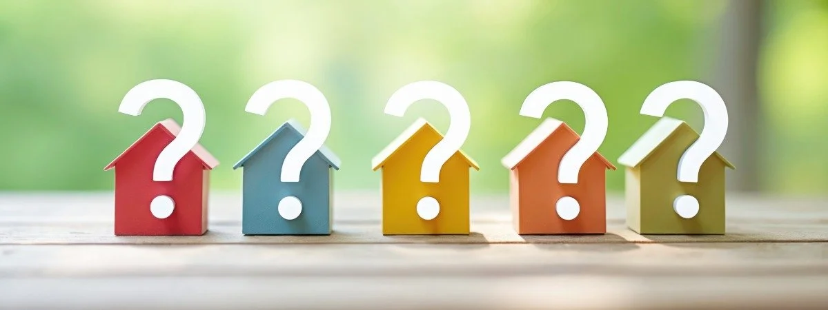 home buyer questions image with small homes lined up with questions marks overlaying the photo