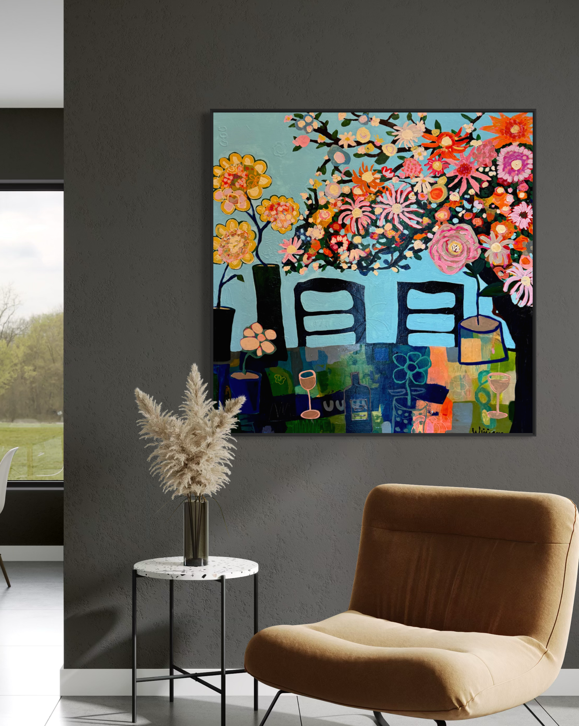 One Side of Summer by Elizabeth Williams displayed on a dark wall beside a window, with a brown lounge chair in the foreground.