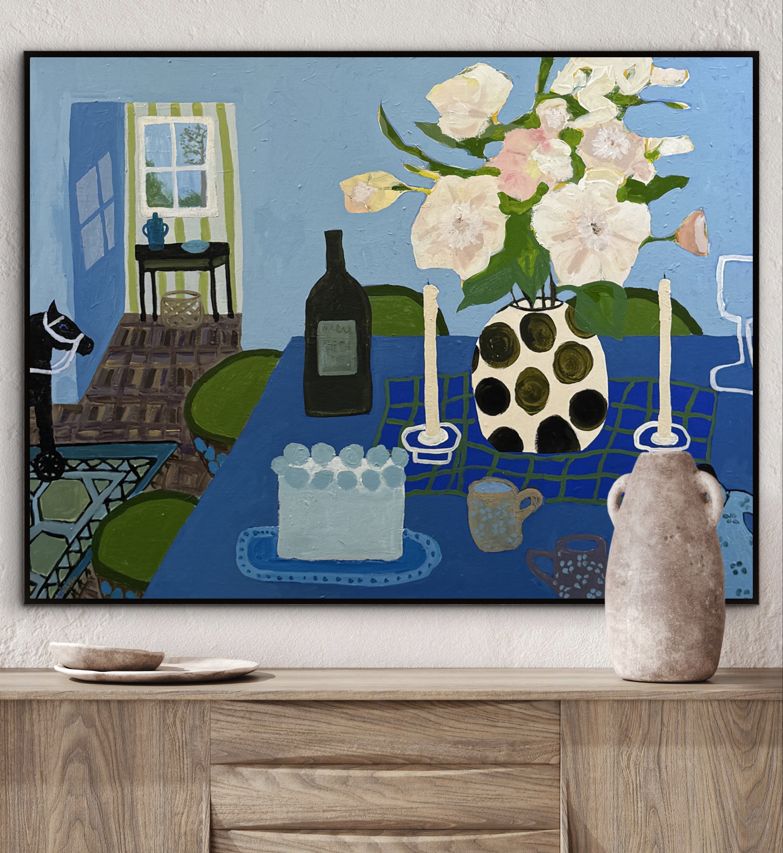Before the Cake, original contemporary still life painting featuring a blue table setting with candles, flowers, a wine bottle, and an open doorway.