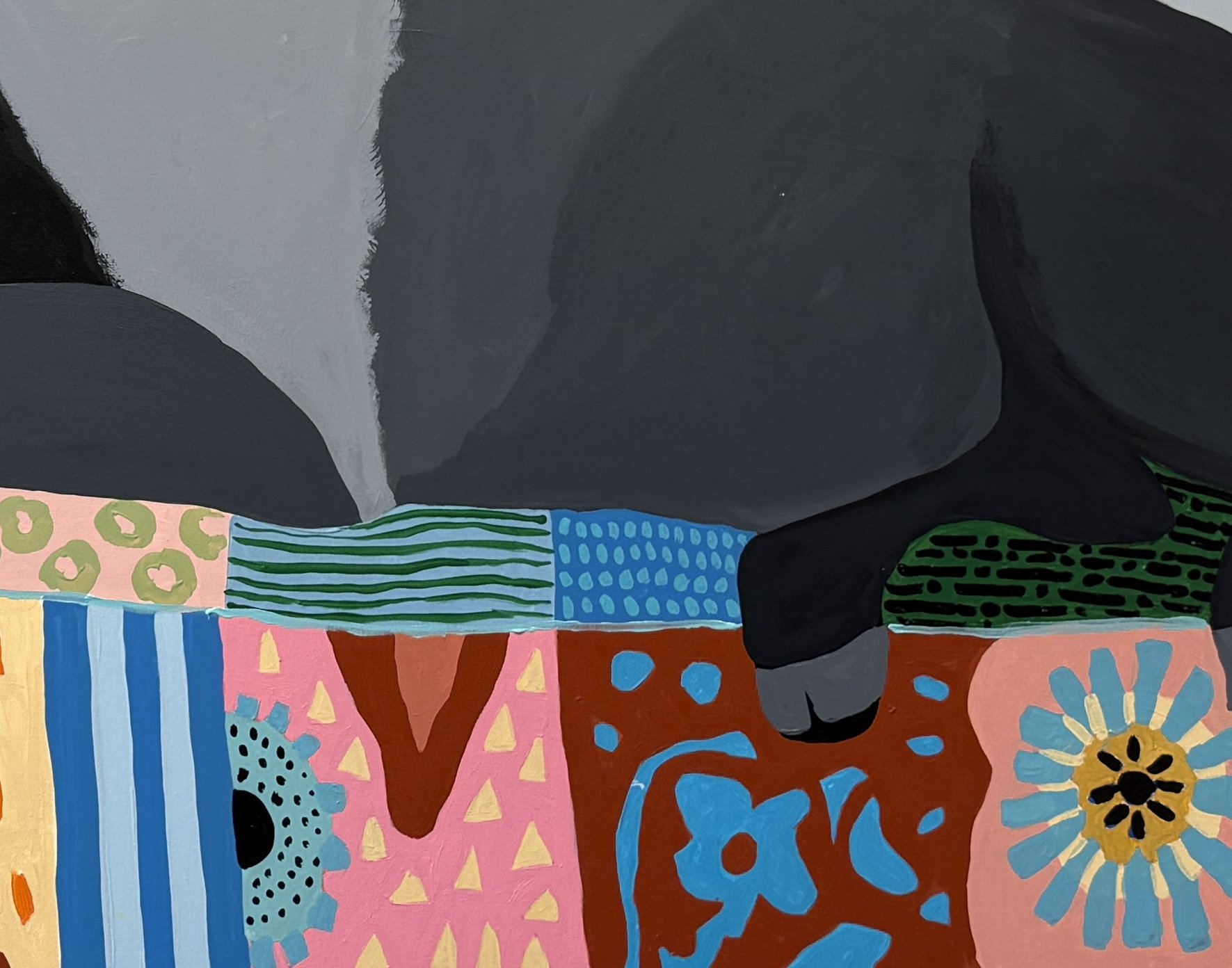Detail of the bison and colorful patterned sofa in The Matter of Cold Tea.