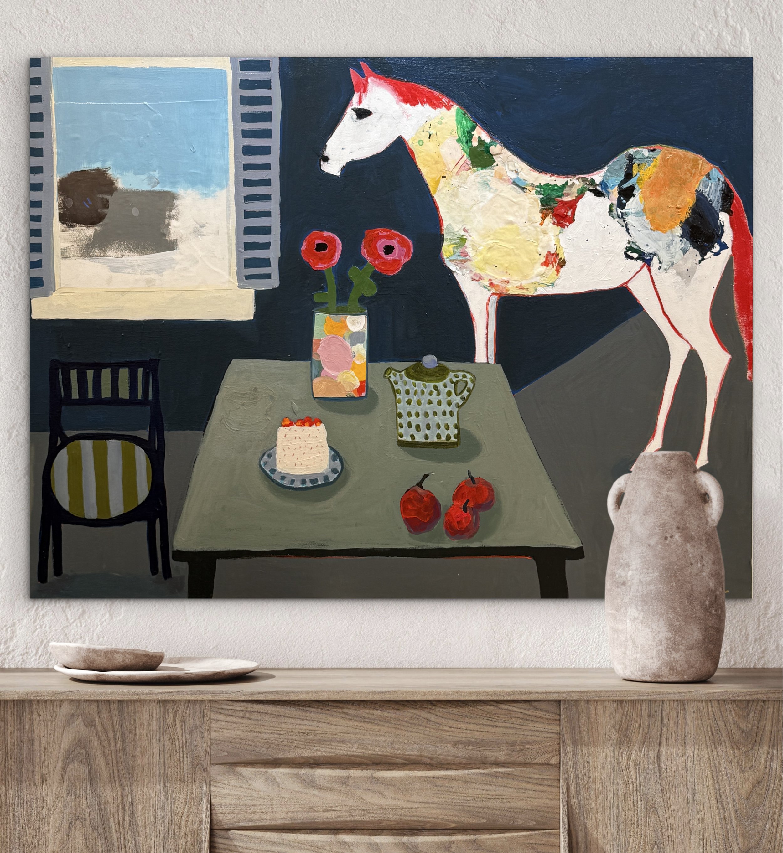 Not About the Cake, original contemporary still life painting featuring a table setting with cake, flowers, fruit, and a white horse positioned beside the table in an interior space.