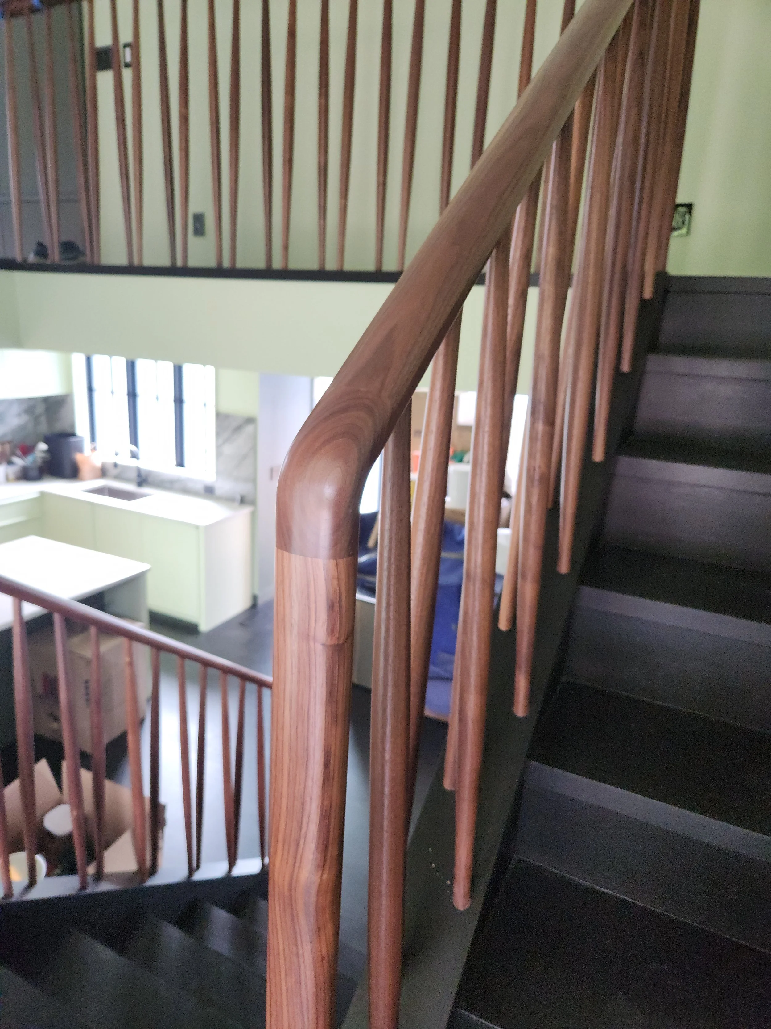 Walnut handrail and graphite stained oak treads