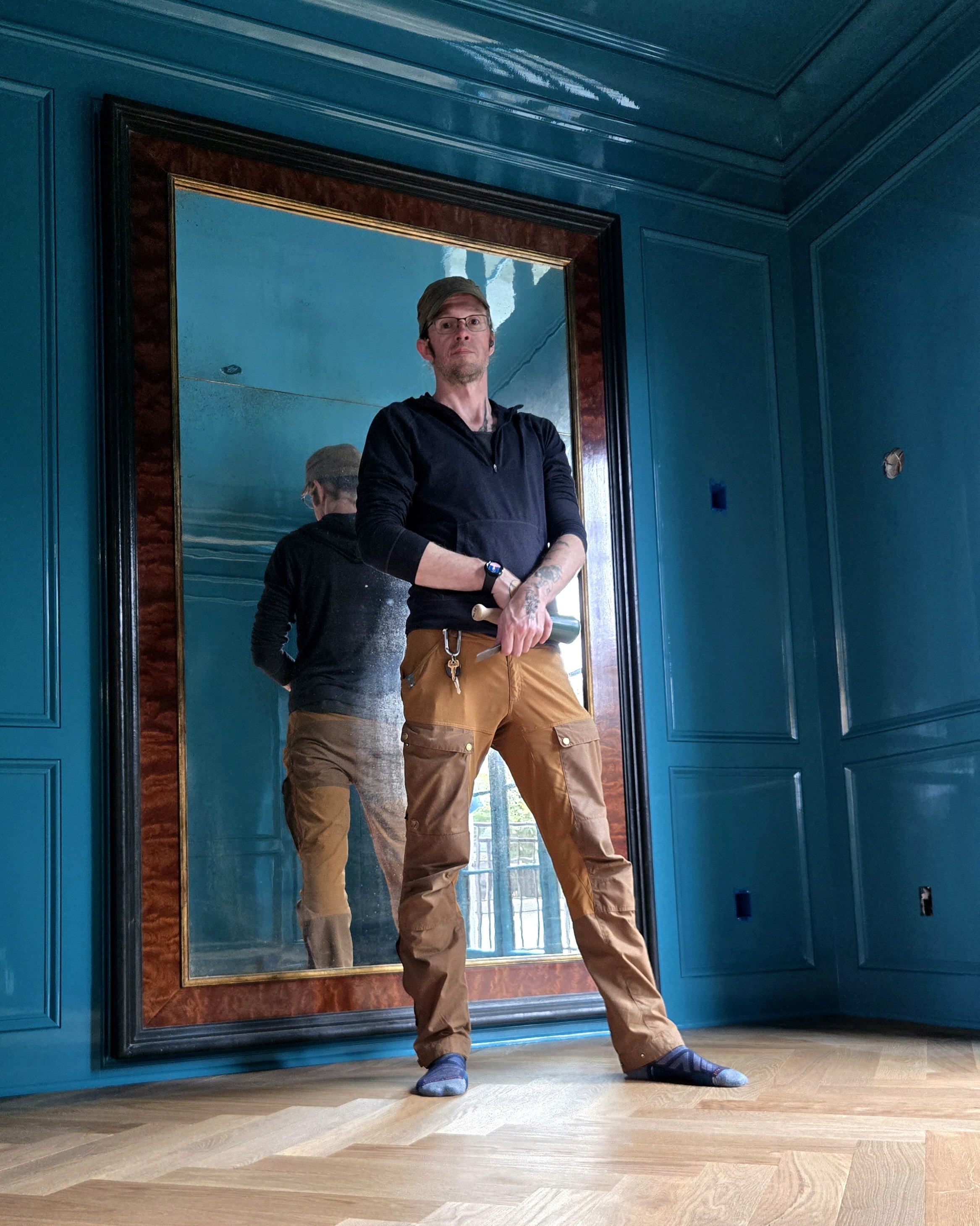 Owner of PNW Woodwork, in candy coated wood paneled room