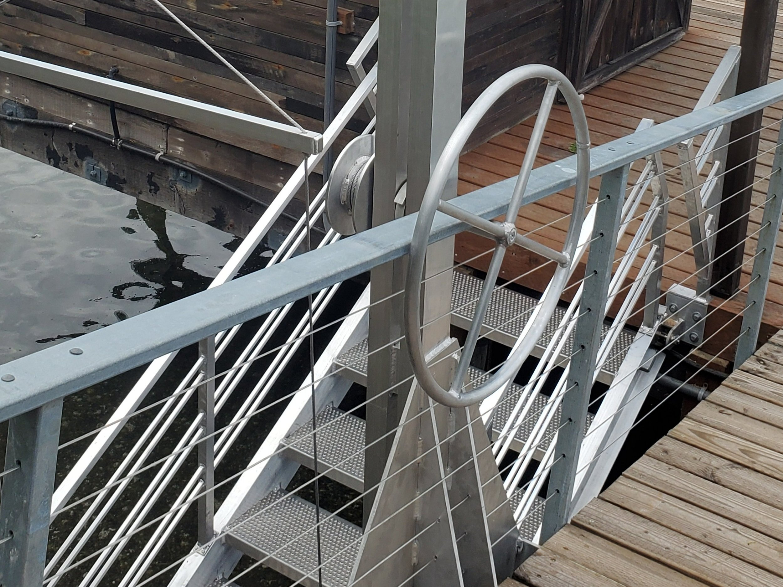 Aluminum Stairs and Gantry for Dock to Beach access, clients were in their 90s, everything geared for them to be able to operate it with ease.