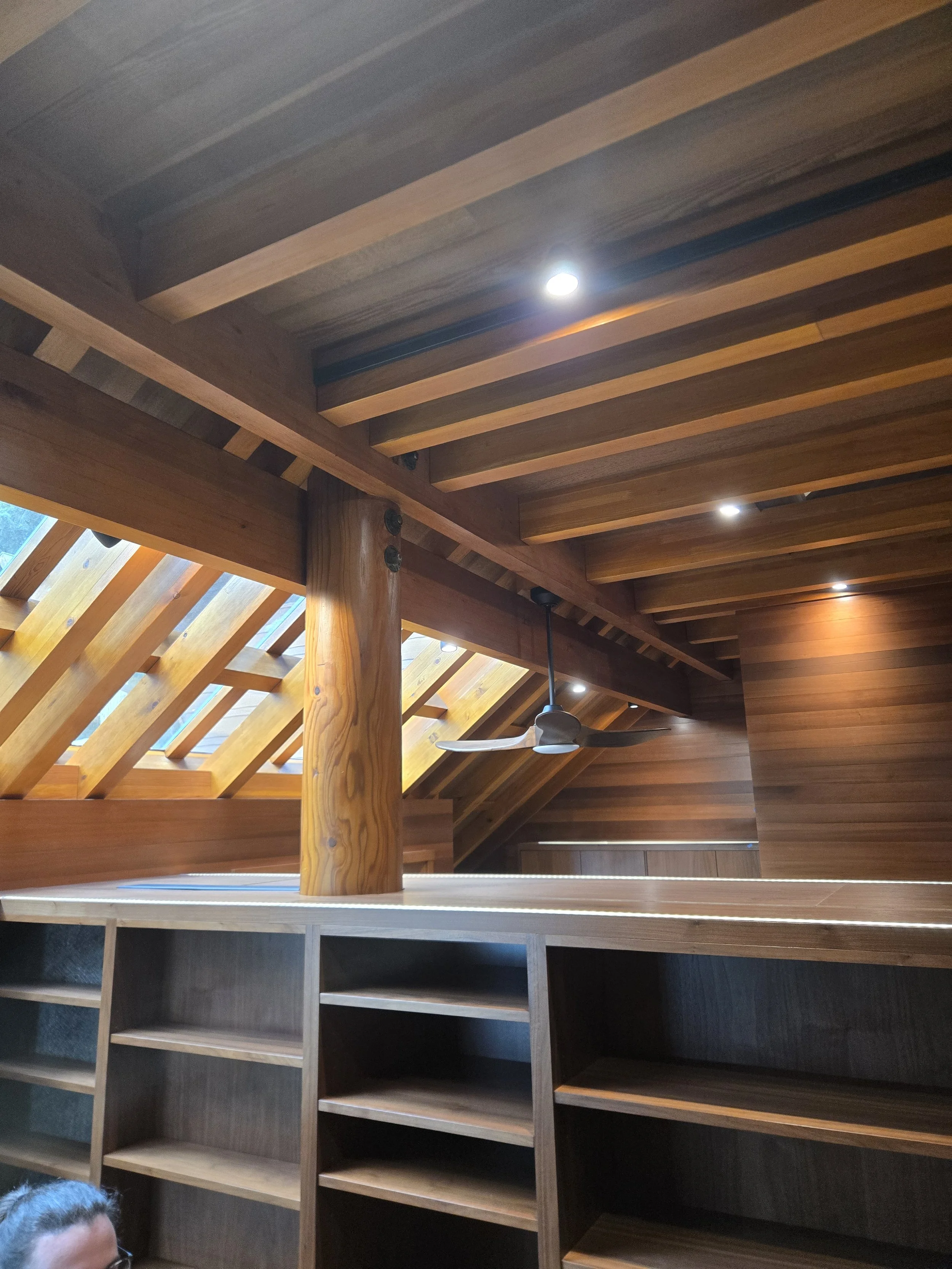 Walnut Cabinets under the fir paralam beam work and cedar ceiling panels
