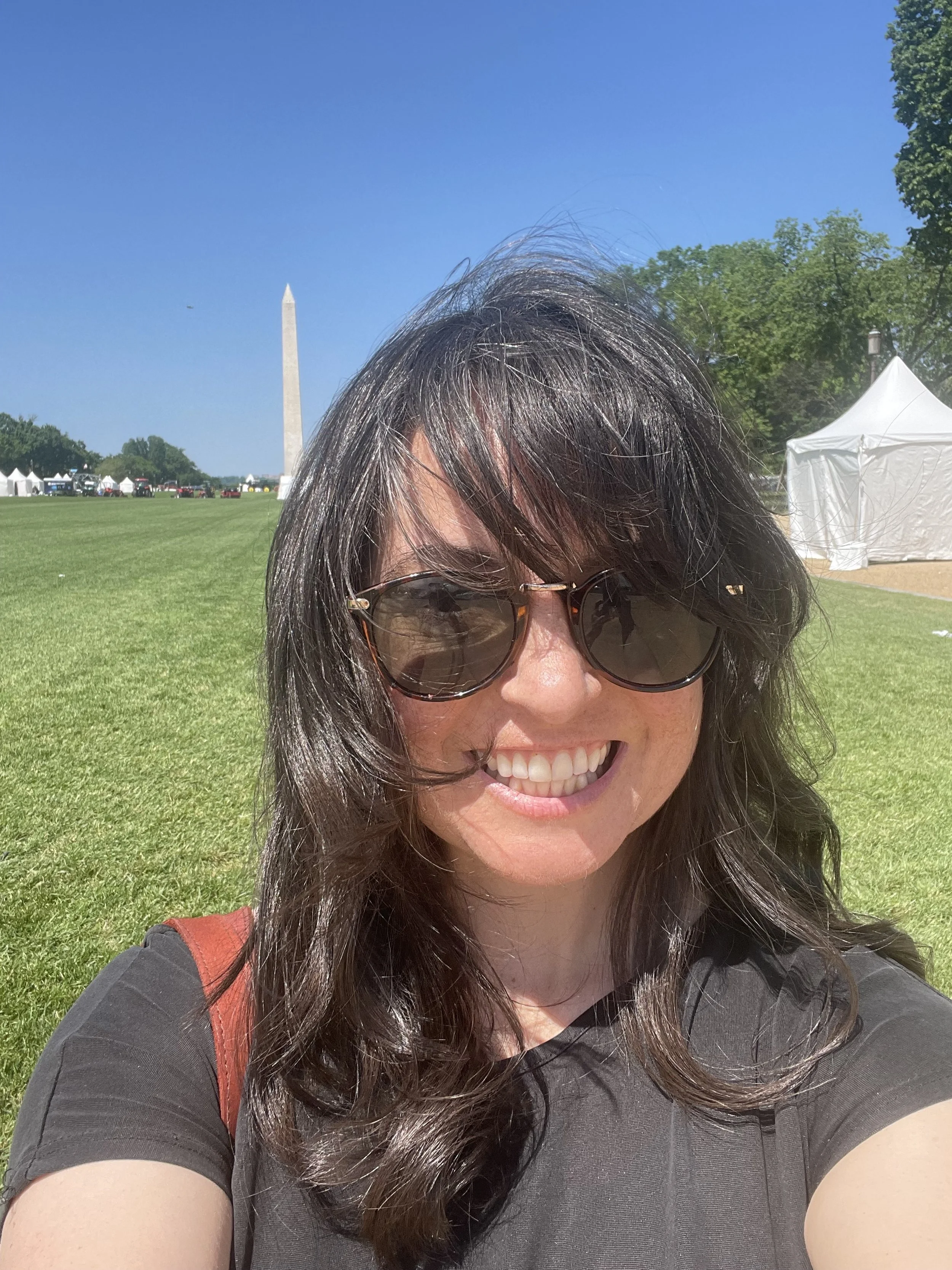 Woman on the National Mall with the Washington Monument in the background