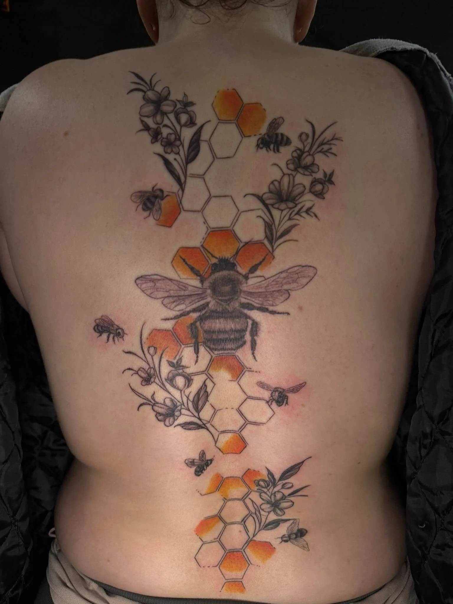 Single session back piece.

Had a lot of fun designing this one and building it to flow naturally with the spine &mdash; black &amp; grey with some color to break it up.

All intention, no filler.

Now booking full day sessions at special rates.
DM m